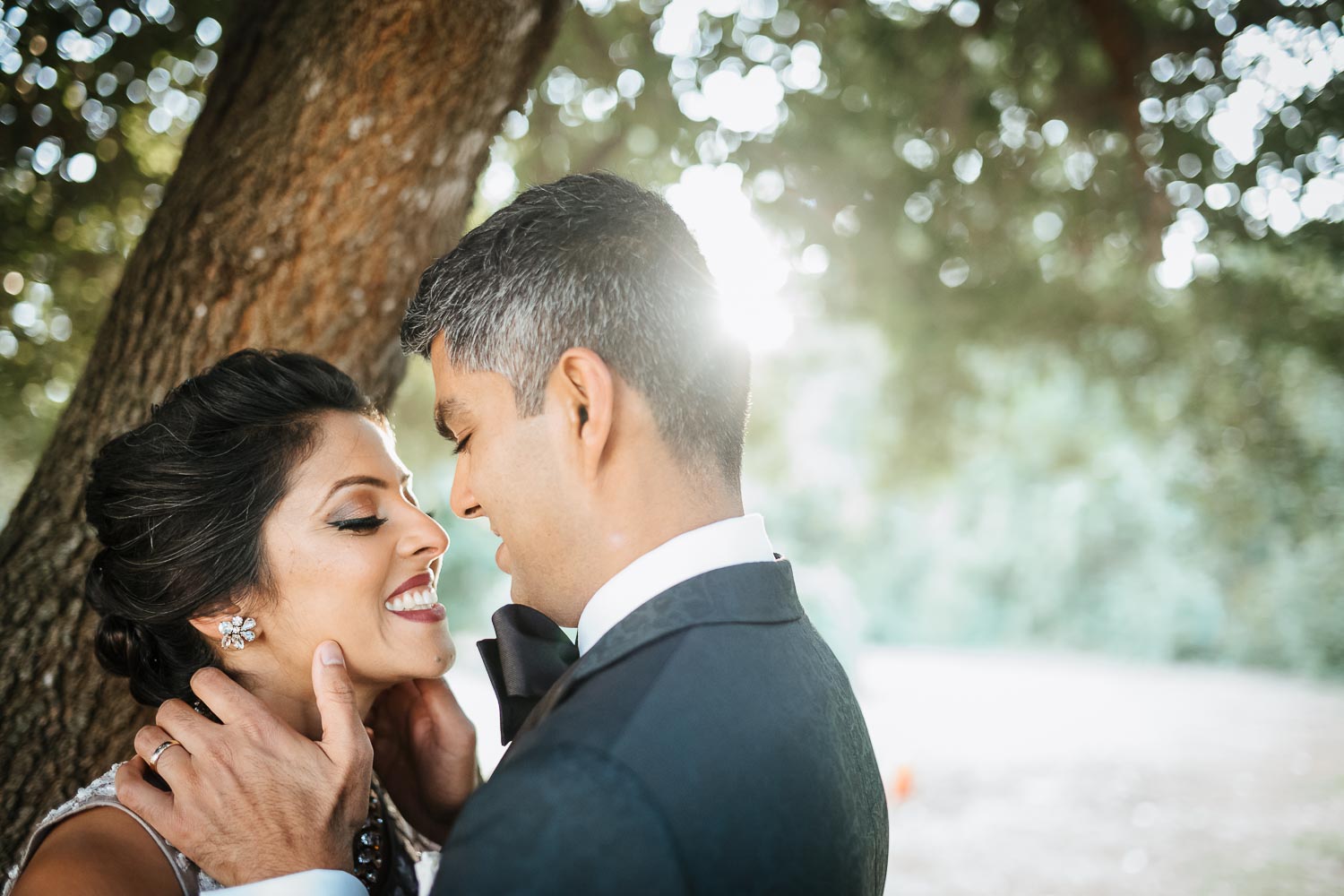 Newly wedded couple Naha and Mrugesh caresses her cheek at Butler Park Austin