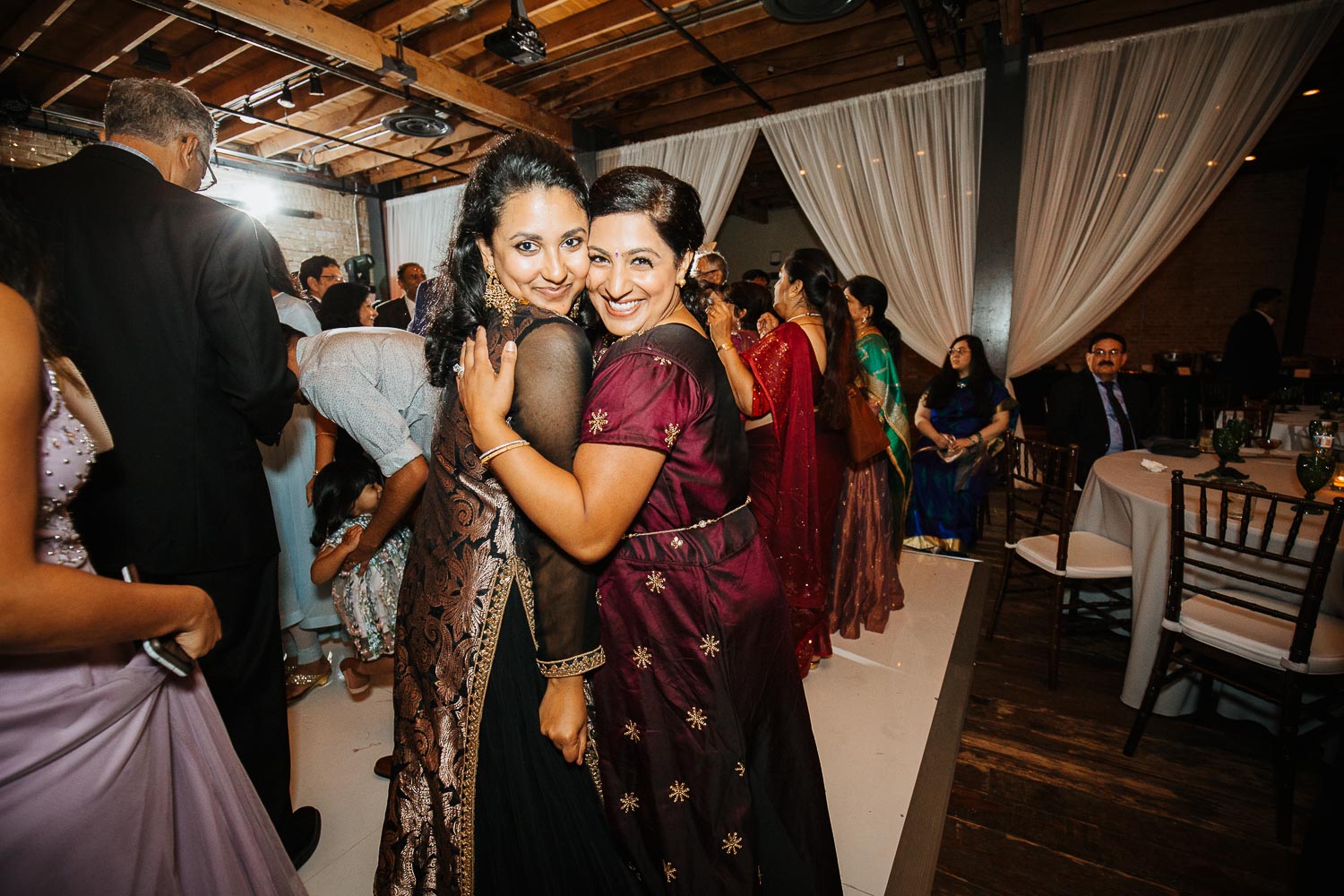 Guests pose for the camera Brazos Hall during a wild wedding reception