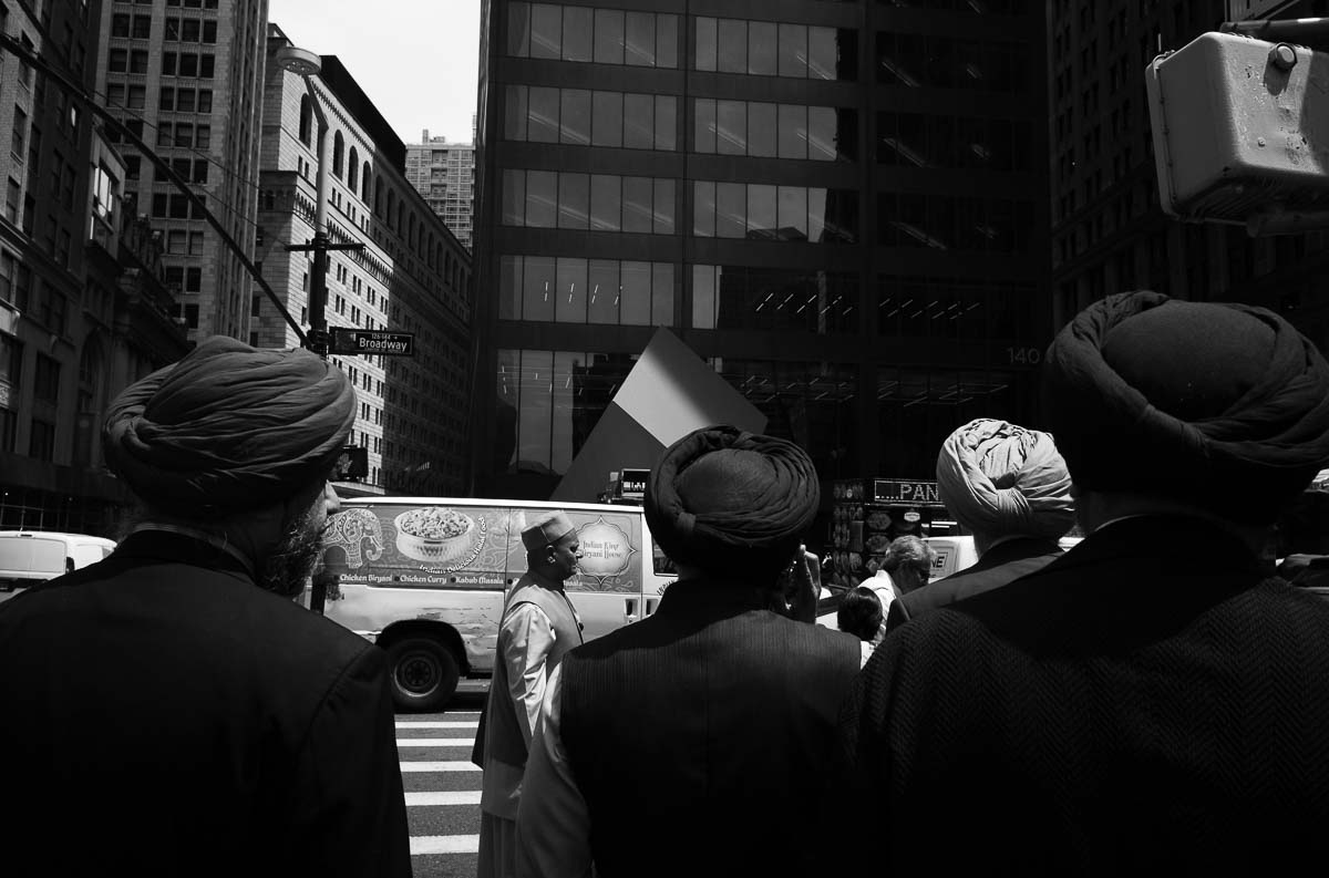 Sikh men wrap their long hair with a turban crossing the street on Broadway, NYC - L1000256