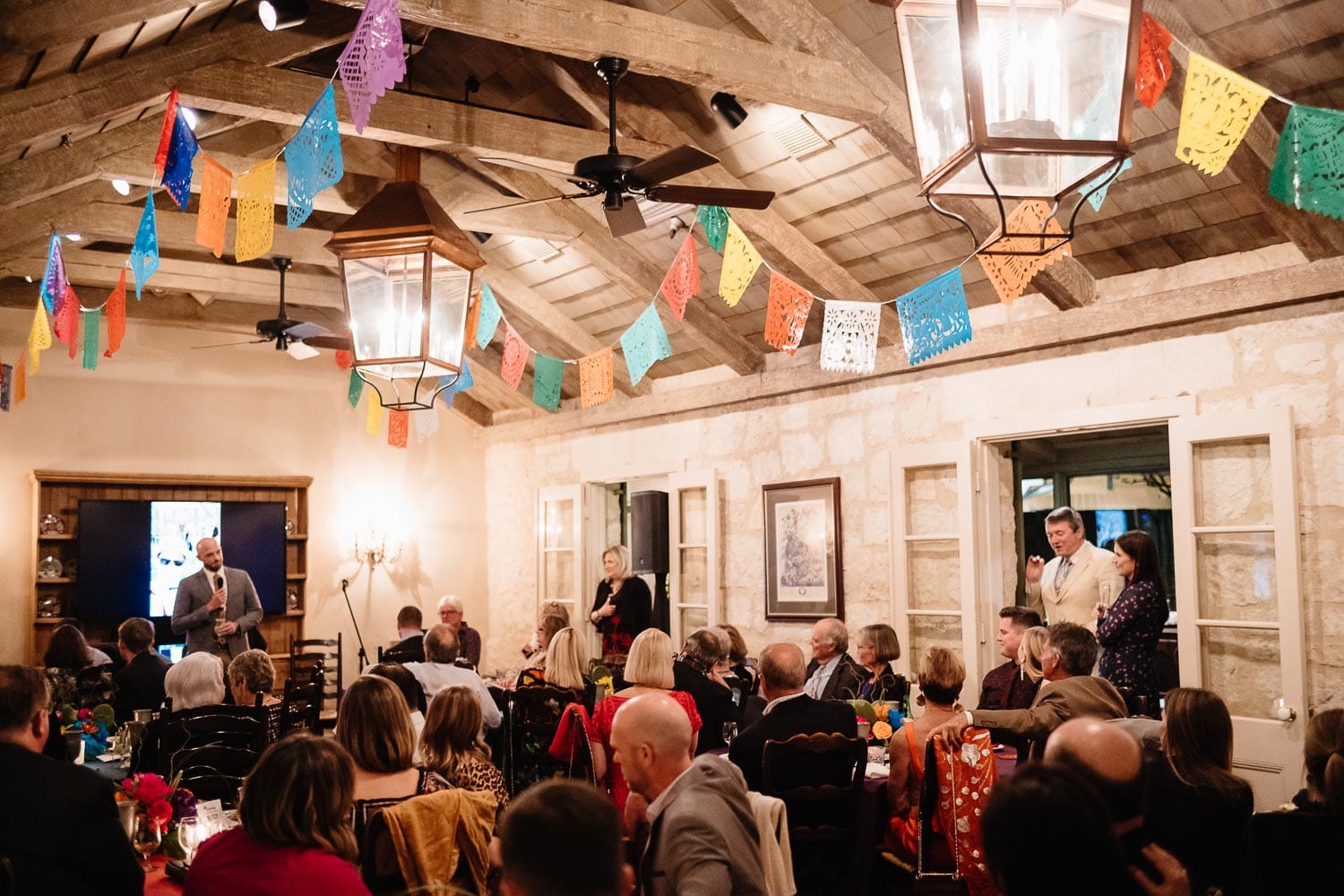 The best man toasts the couple at a rehearsal welcome dinner at Club Giraud