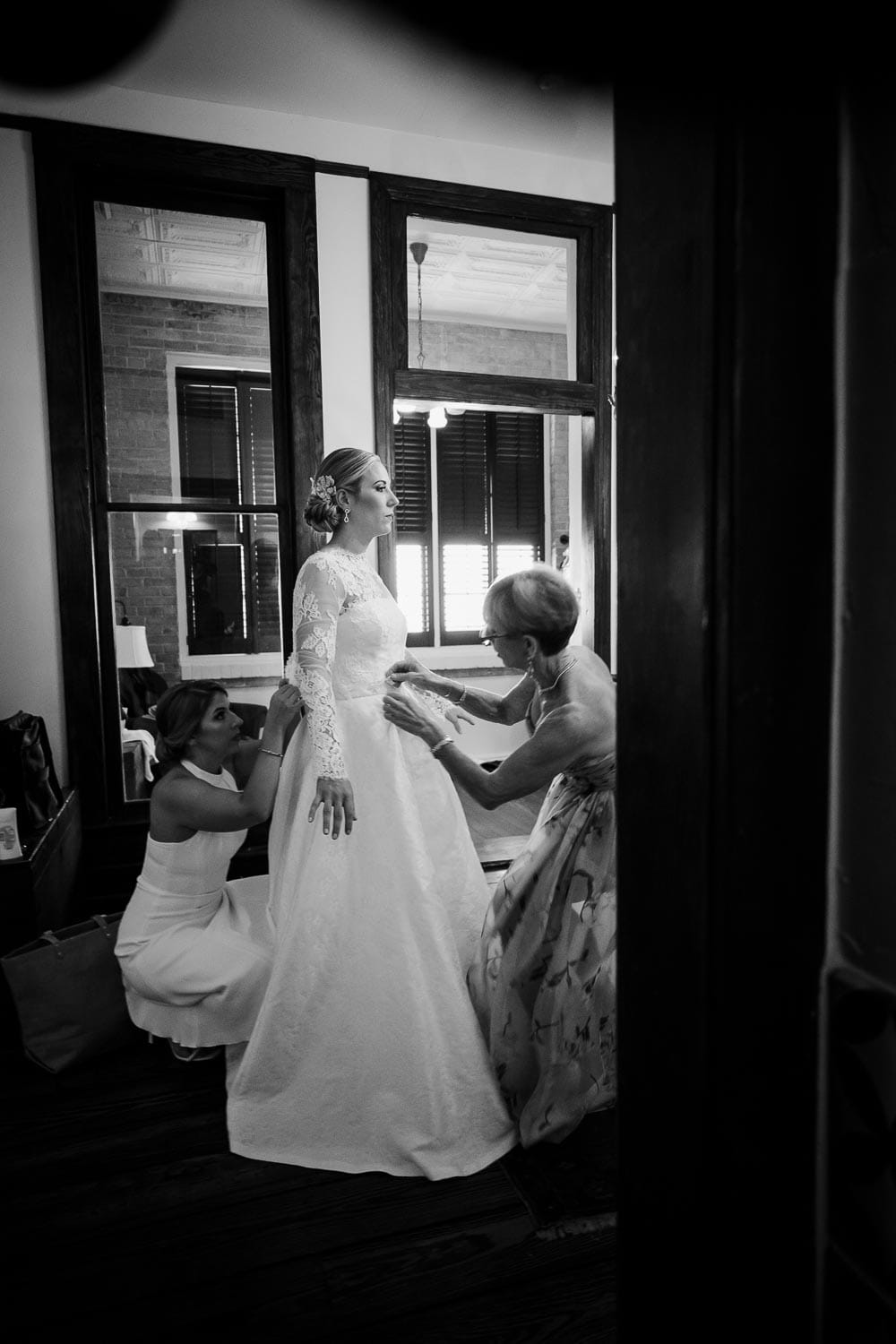 Mother helps bride get ready at Hotel Havana