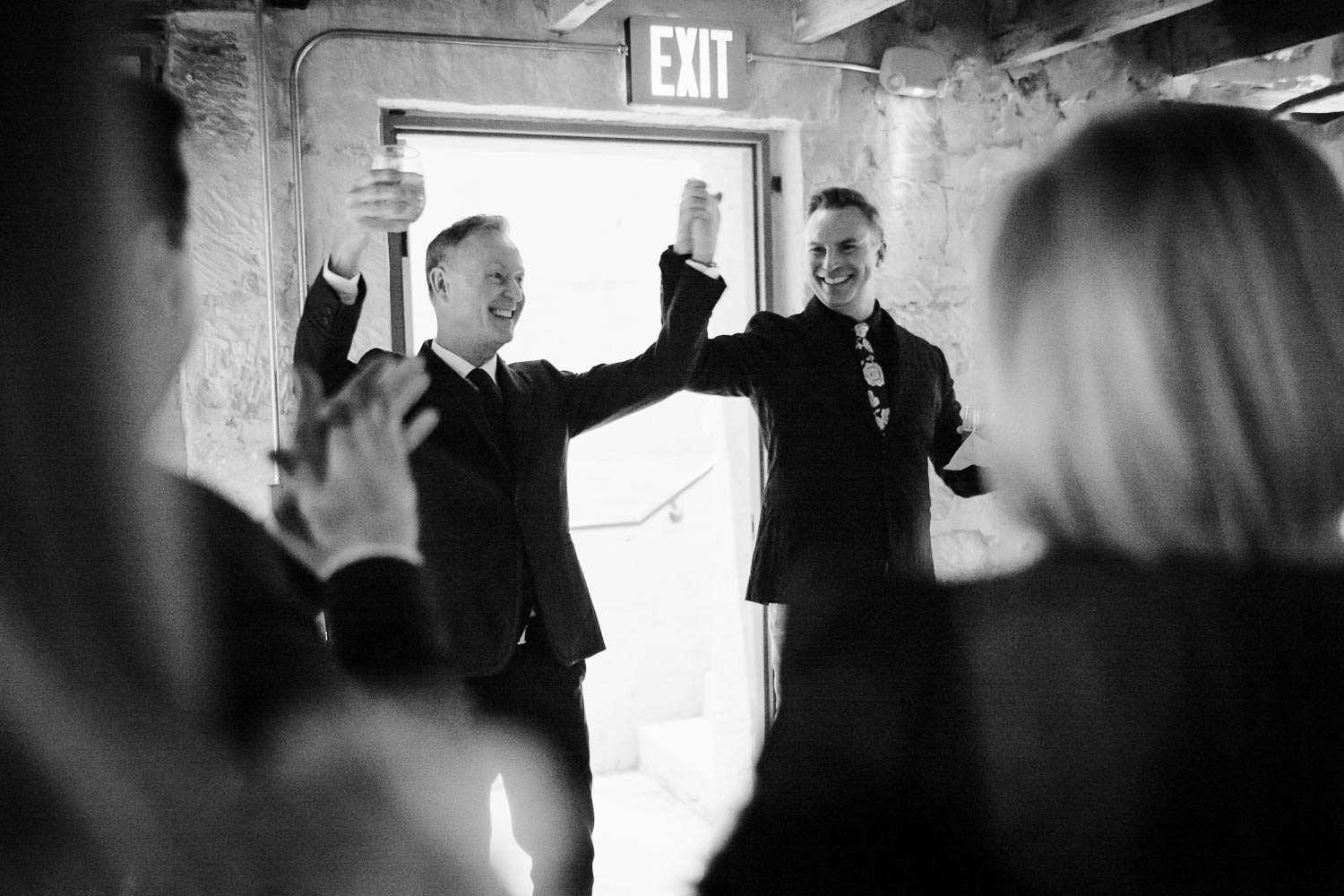 LGBTQ and gay wedding Couple just married greet guests during cocktail party below at Ingenhuett on High LM104538