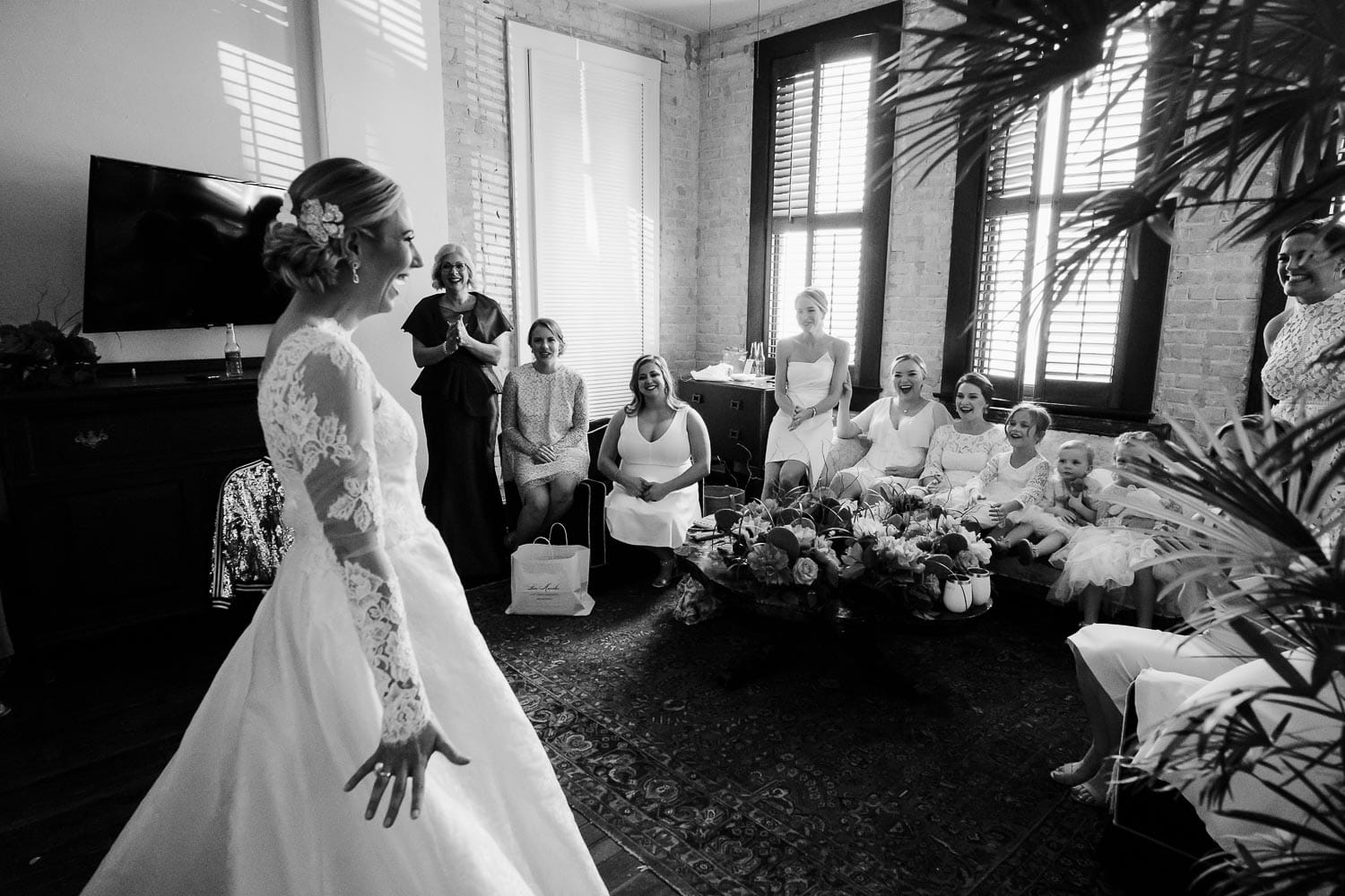 Kelsey the bride makes her entrance in her dress for the first time to bridesmaids