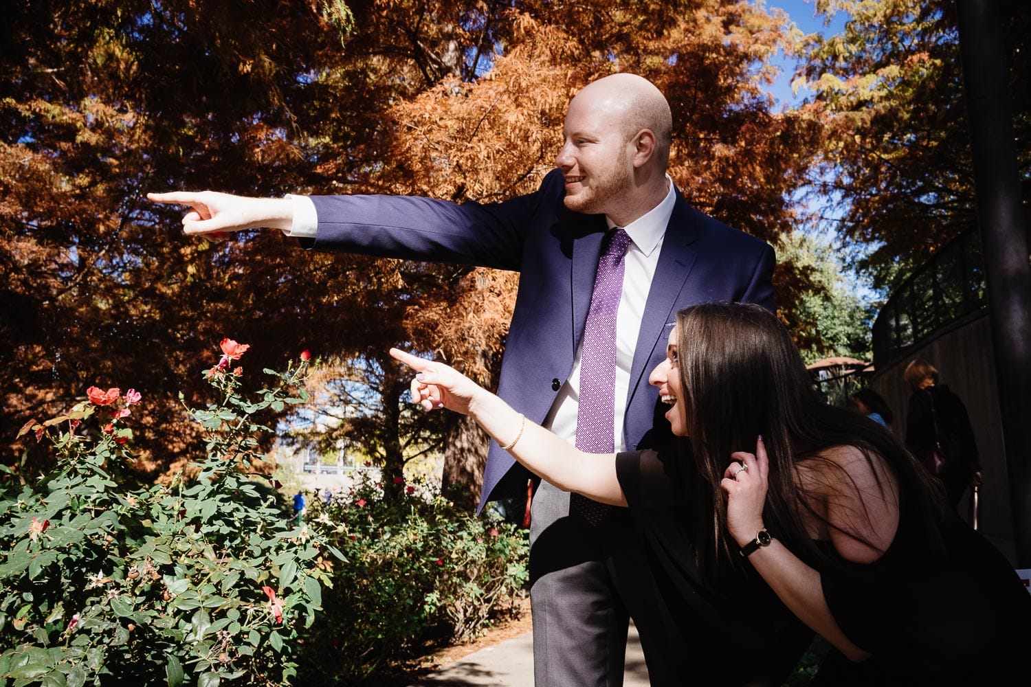 Engaged couple ham it up in goofy way during engagement shoot