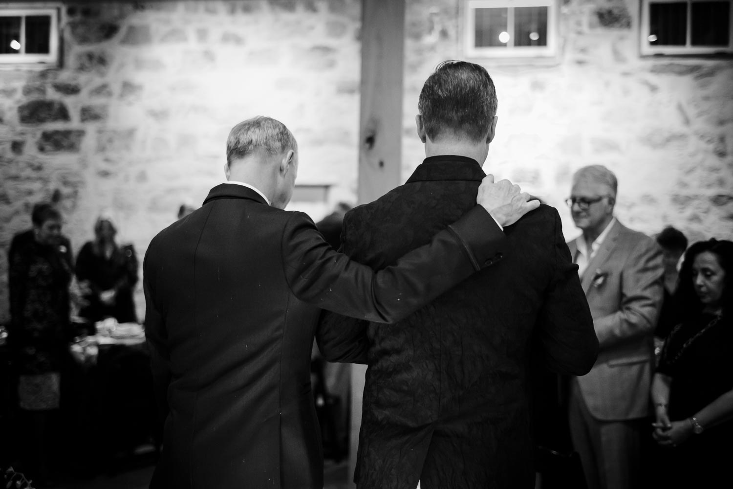 Wedded couple embrace during a prayer LM104635