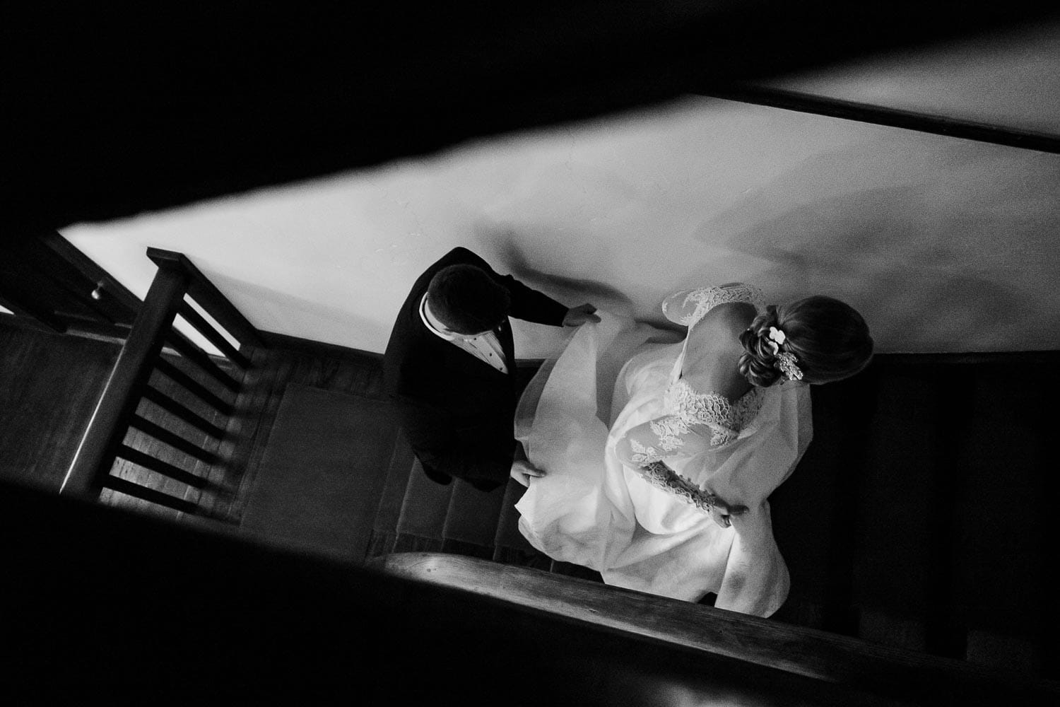 Couple climb staircase inside Hotel Havana in San Antonio on their wedding day