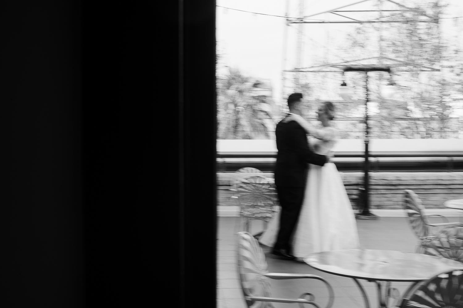 A couple practice for the wedding dance on veranda of Hotel Havana