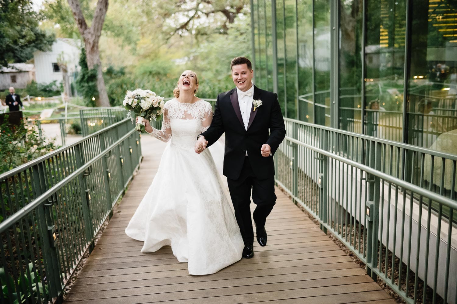 Laughter and joy as couple walk away from the wedding ceremony at The Witte Museum