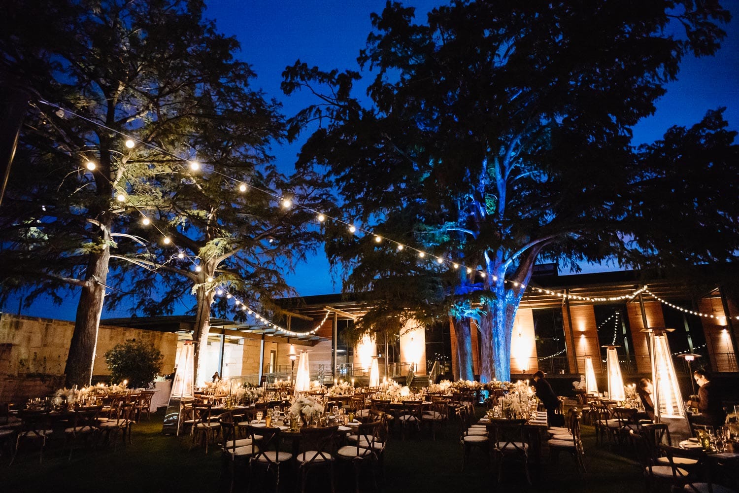 A wide shot captured at dusk of the The Witte Museum wedding outdoor fall reception