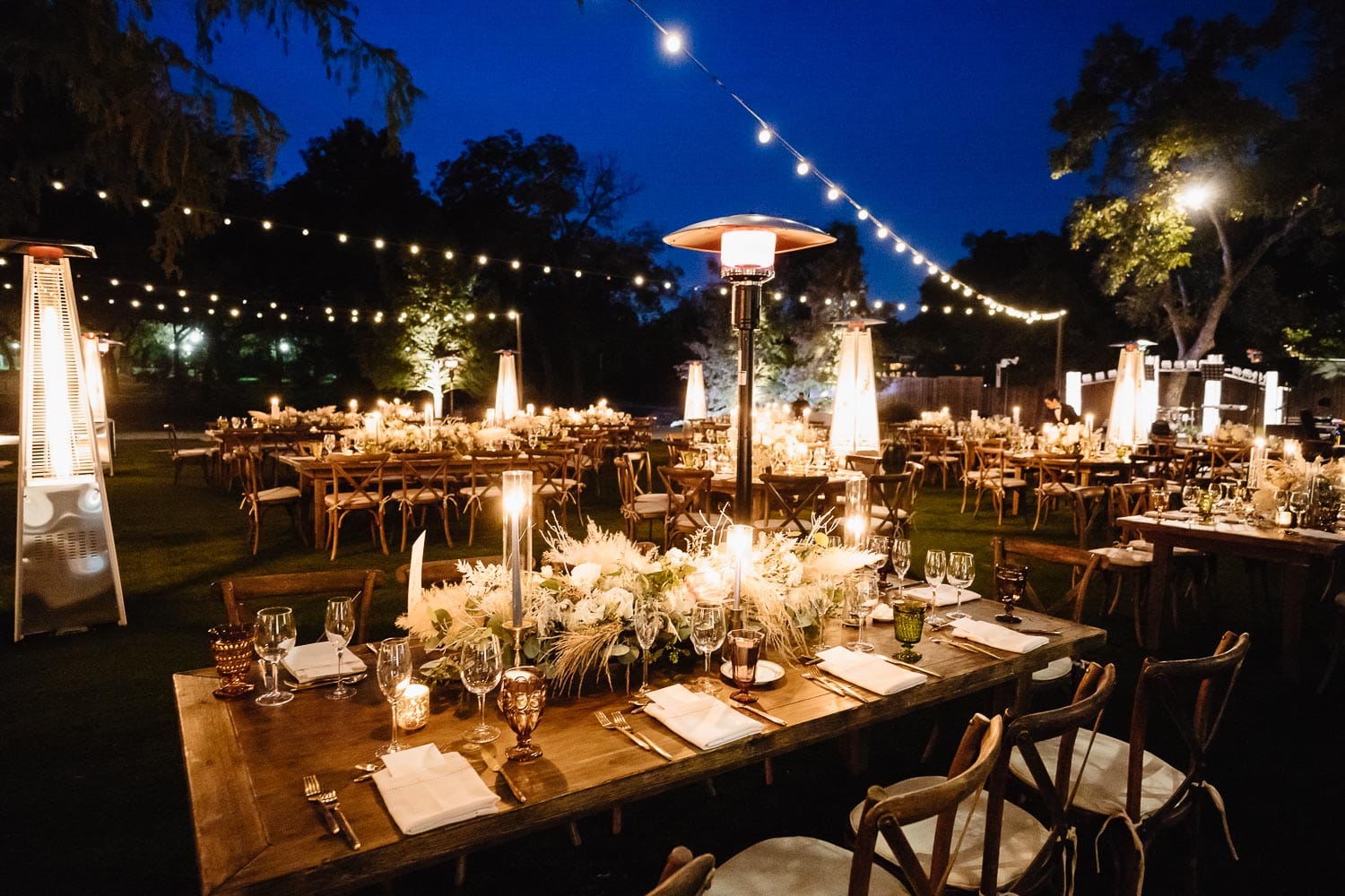 Table aglow in candle light at The Witte Museum wedding reception setup