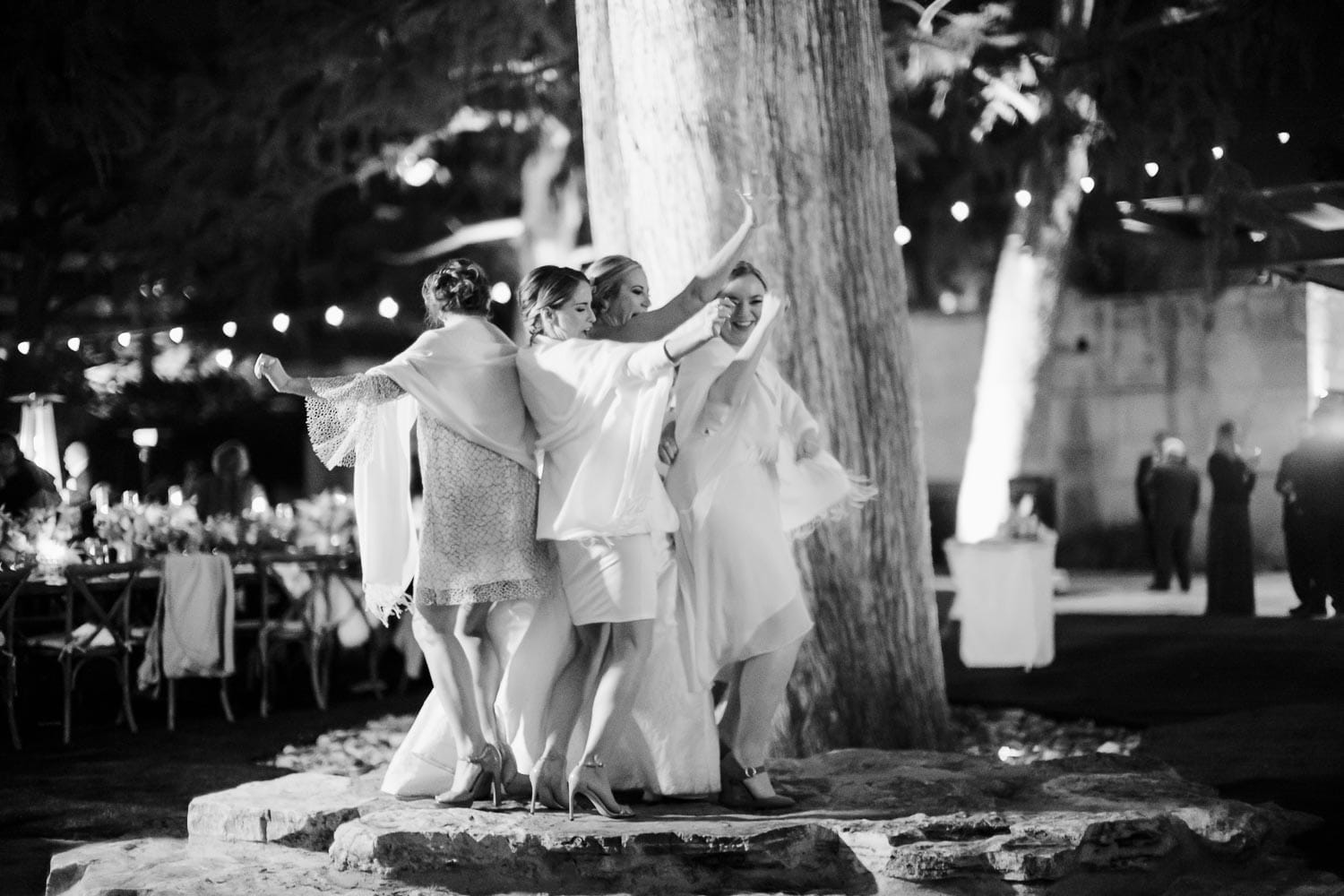 The bride and bridesmaids dance crazy at The Witte Museum