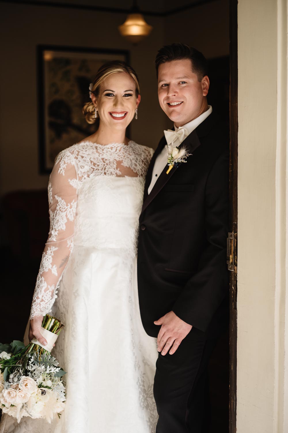 The couple pose inside doorway to Hotel Havana