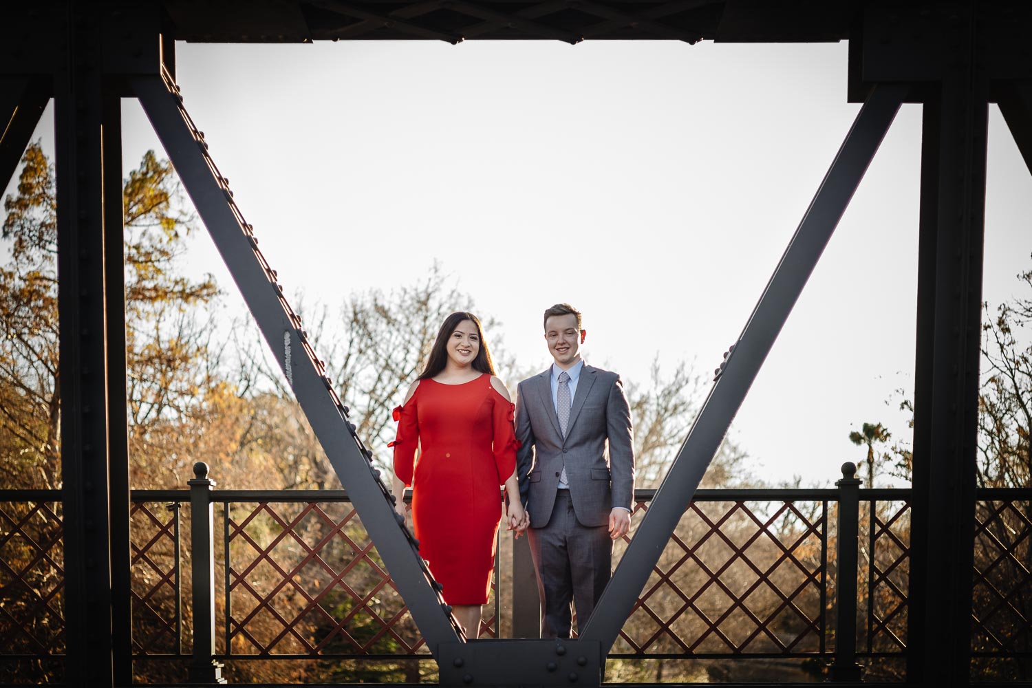 Engaged couple return to the place he popped the question for engagement session Arsenal Bridge