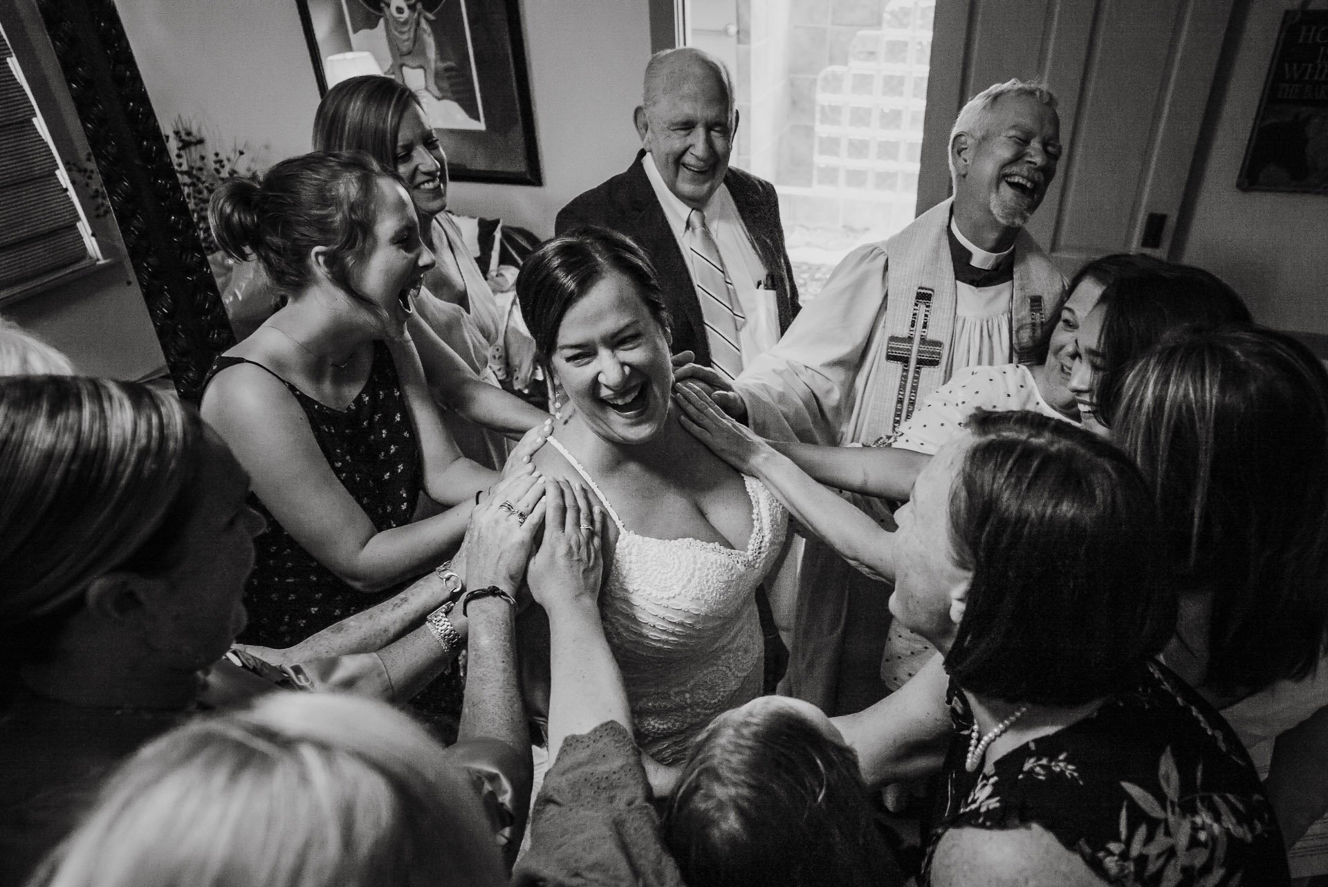 Joyous reaction as bride is surrounded by family and friends