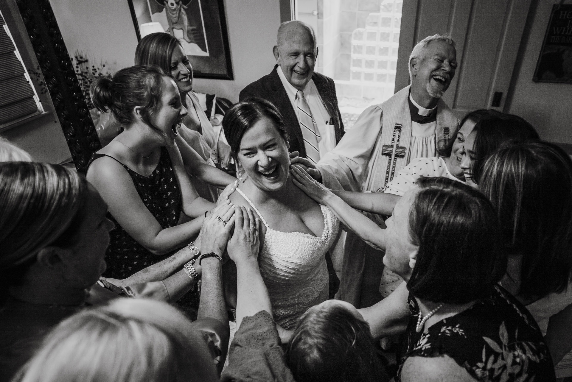 Joyous reaction as bride is surrounded by family and friends