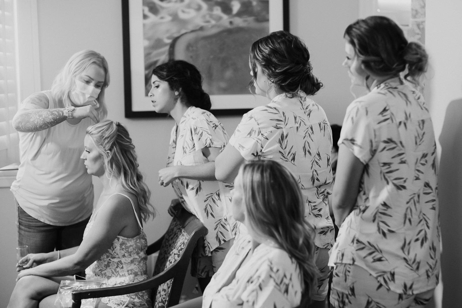 On a wedding morning at Hotel Galvez and Spa,
Galveston Texas. Bridesmaids surround the bride as the hairstylist shows the placement where to fix the veil. Leica M10-P, 50mm Noctilux f1.7 1/180 