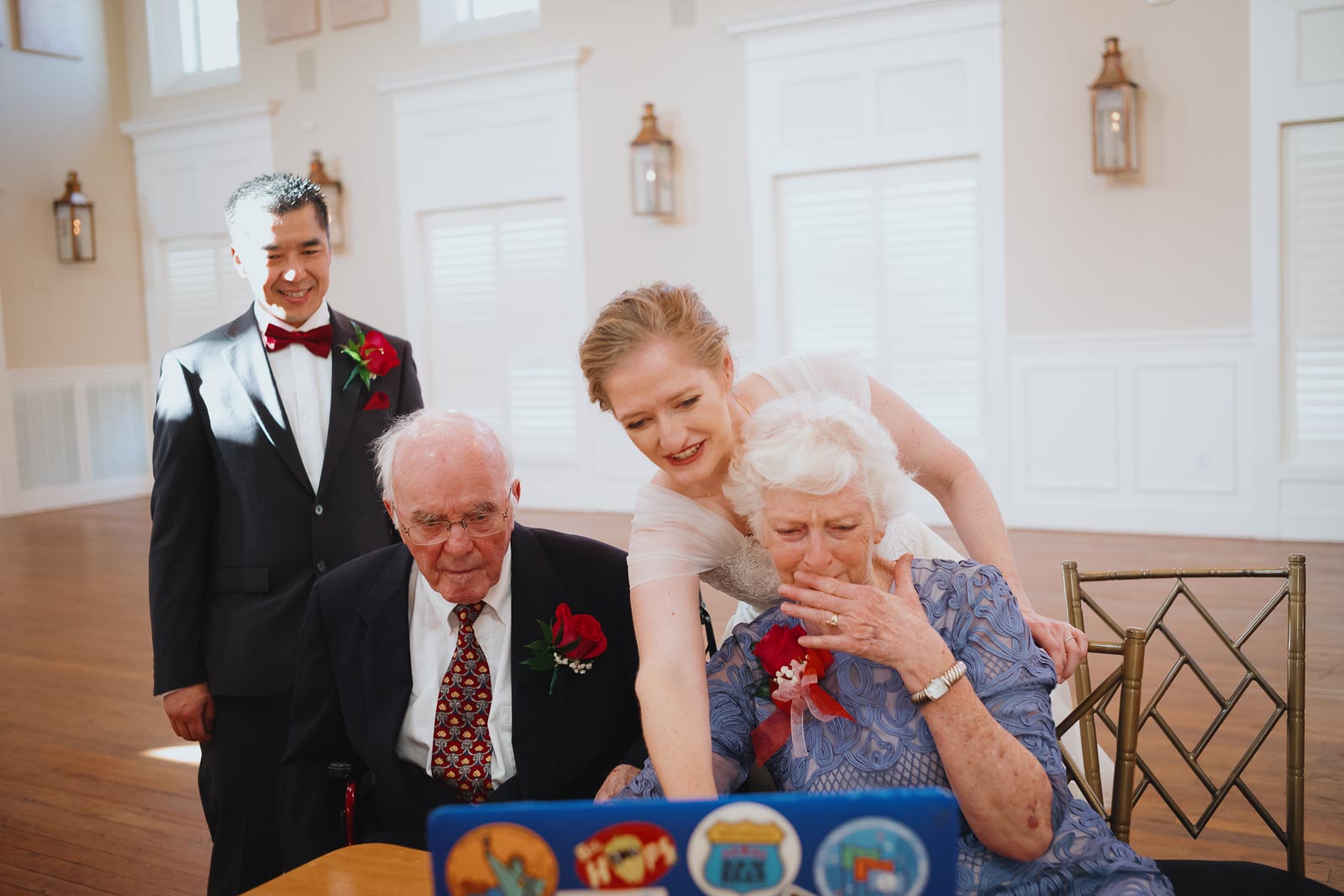 Mother of the bride reacts to seeing friends and family wishing congratulations to bride and groom at Wedding at the The Grande Ballroom in New Braunfels Texas