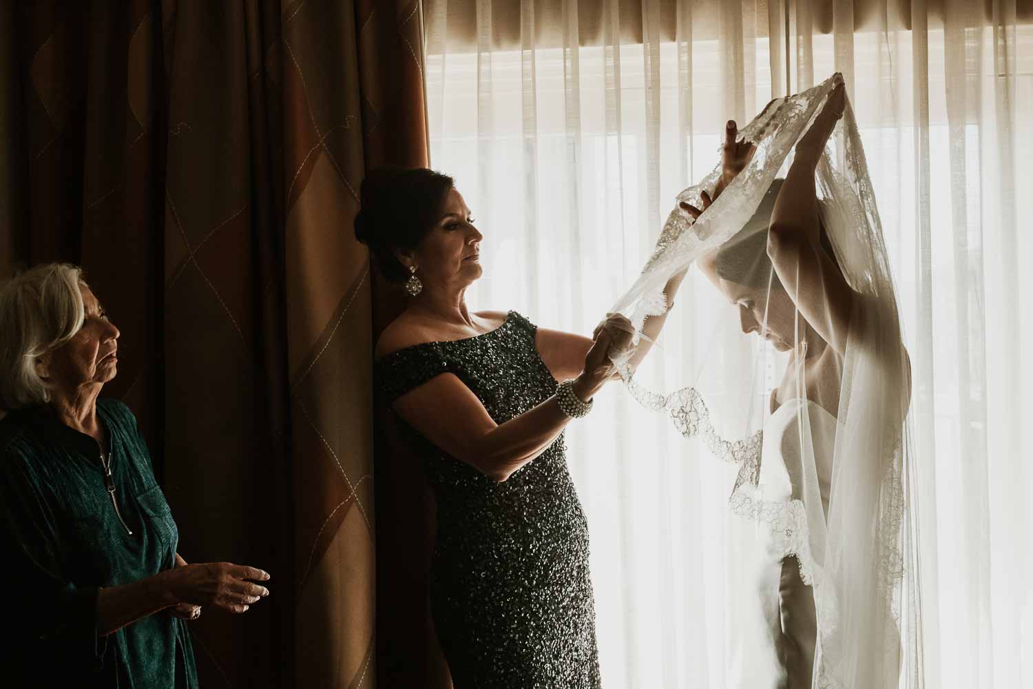 Texas documentary wedding photographer Philip Thomas captures three generations. A bride dresses for her wedding day in San Antonio Texas -photo by documentary photographer Philip Thomas L1001096