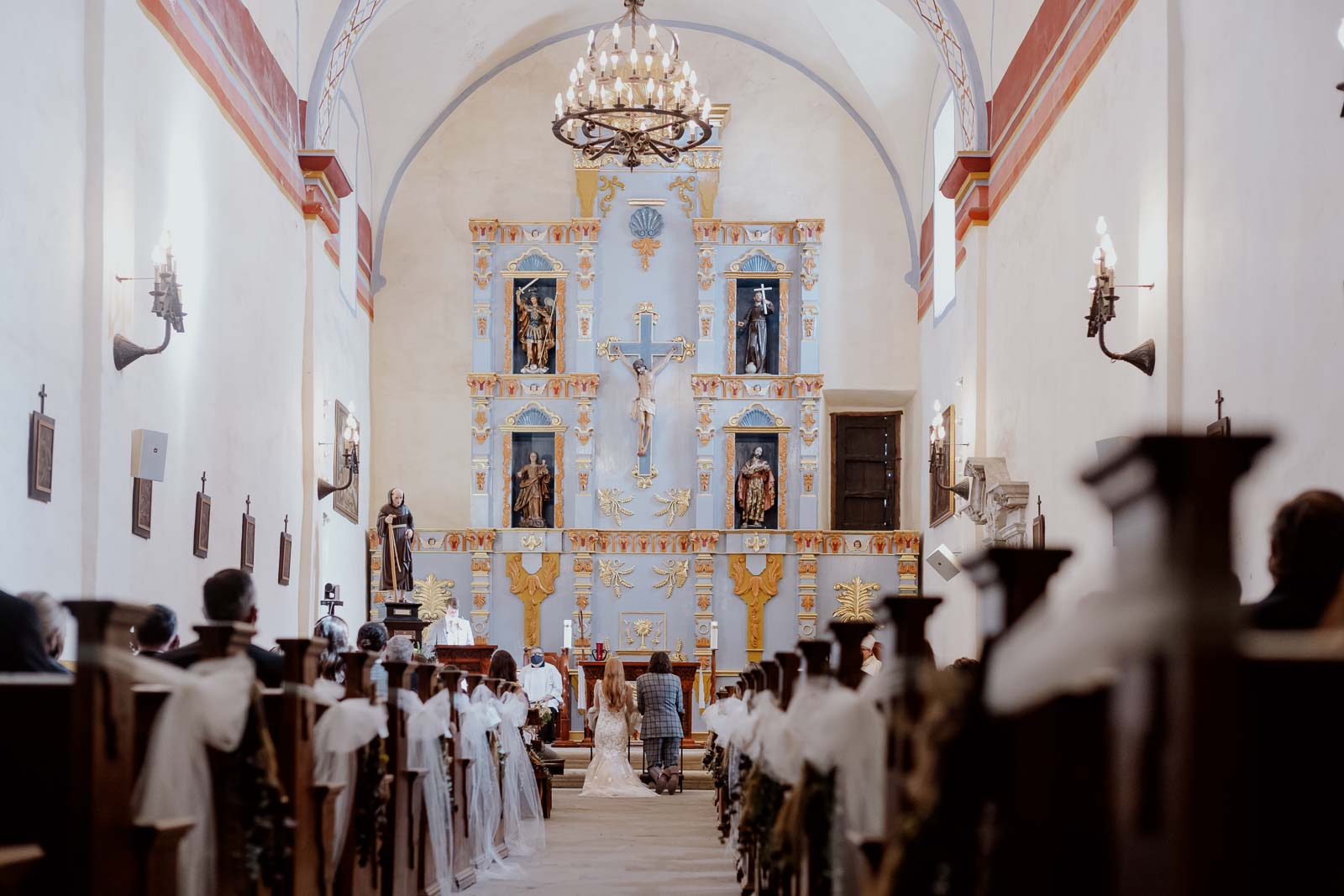 A view from the back of San Jose Missions during a wedding ceremony