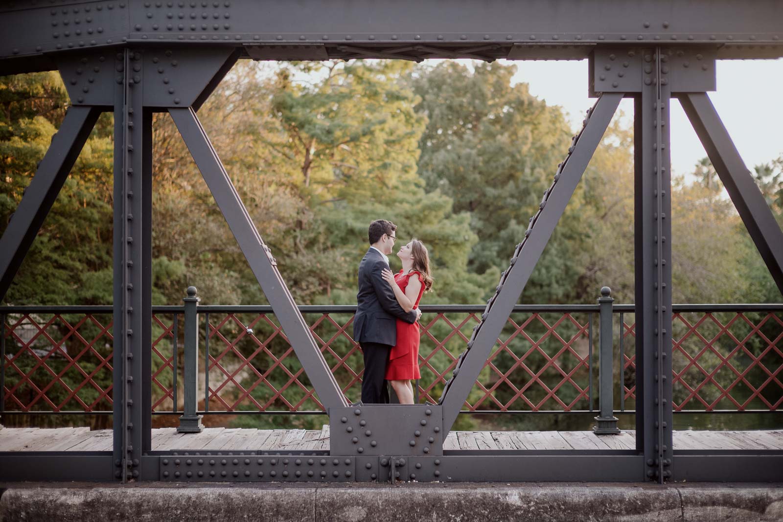 Arsenal Bridge in the King William area shows couple posing on the bridge - Leica Wedding Photographer-- 1San Antonio engagement shoot downtown - Philip Thomas