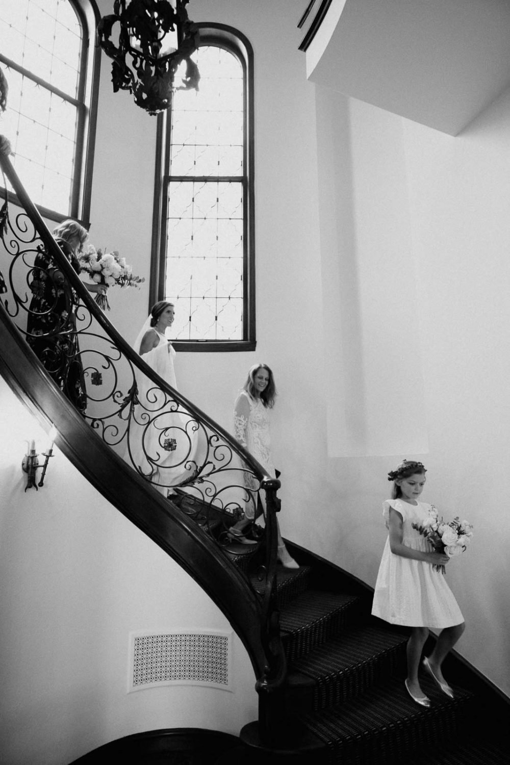 Descending a grand staircase at Commodore Perry Estate Austin Texa pre wedding