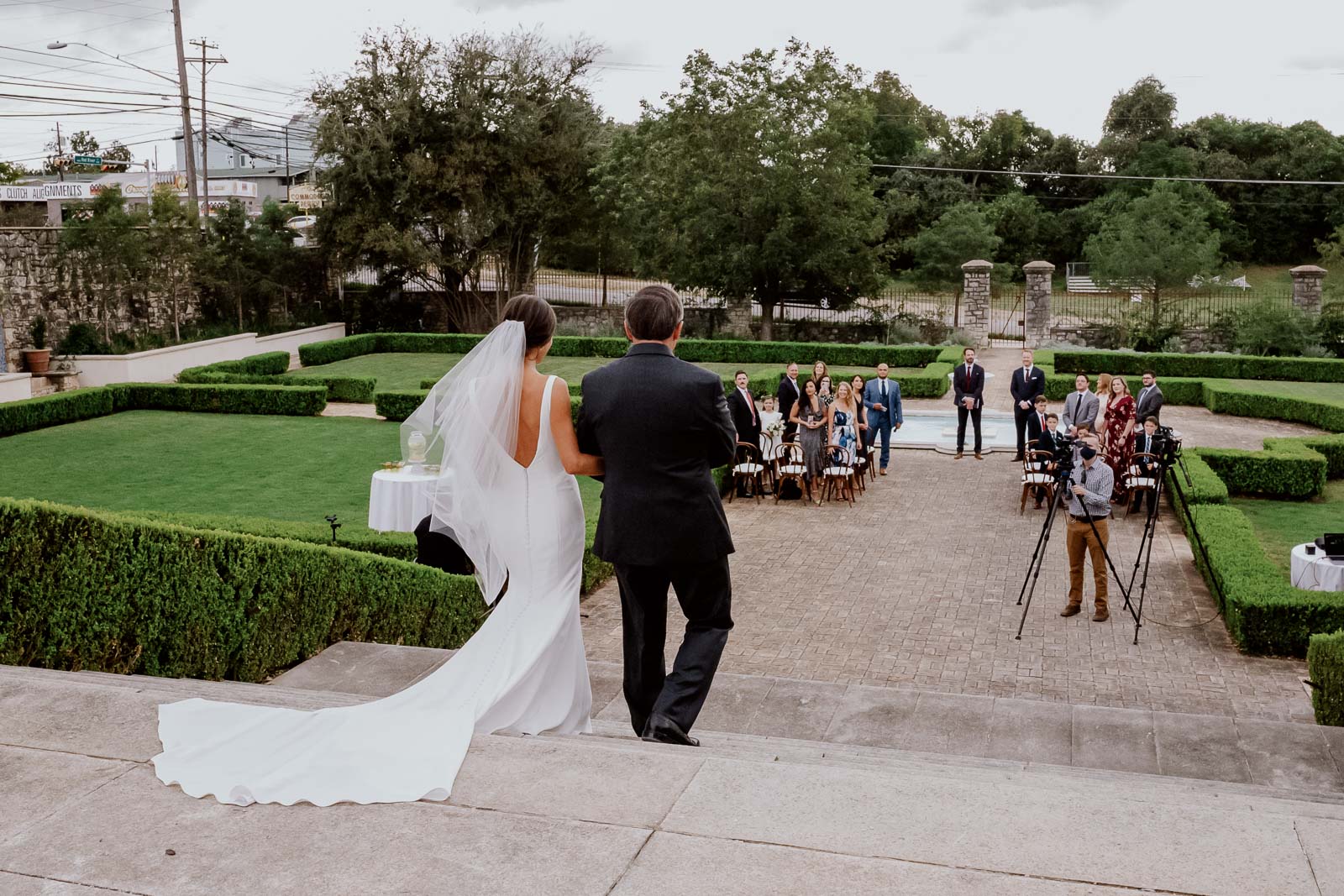 father and daughter walk down the aisle at Commodore Perry Estate Austin Texa wedding ceremony