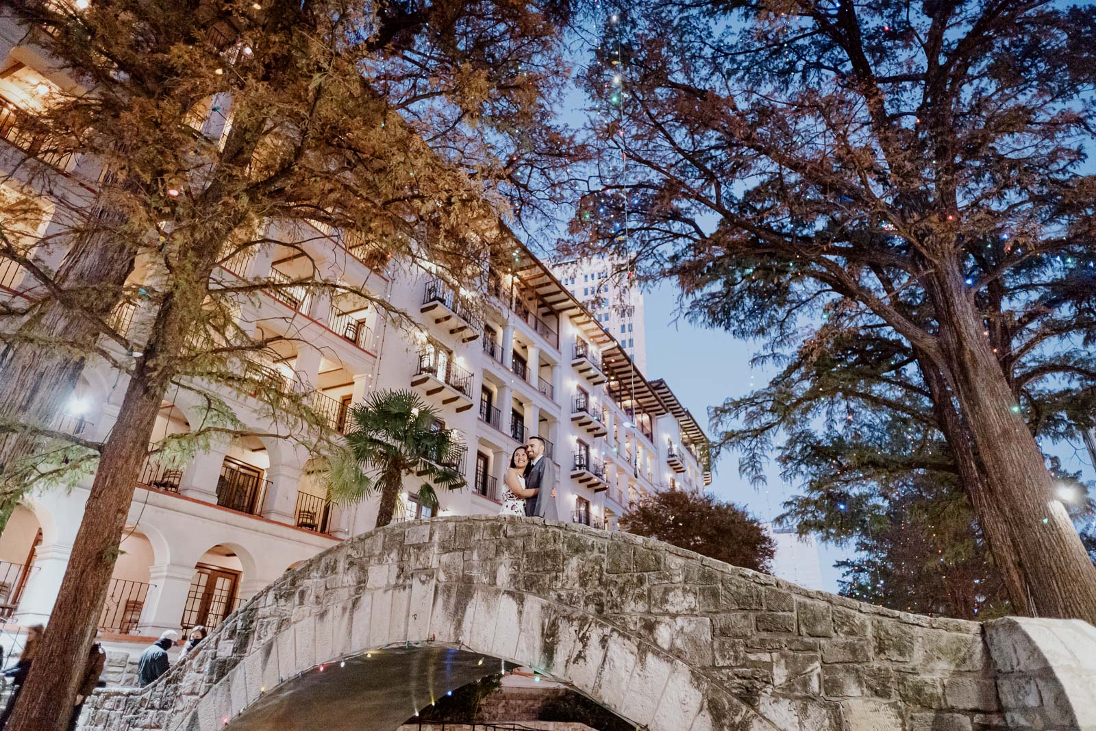 Closed-spandrel arch bridge over San Antonio River ridge over Riverwalk Downtown Christmas Holidays Engagement Shoot in San Antonio Texas-Leica photographer-Philip Thomas Photography- Built 1938-40 as part of a massive undertaking by the city of San Antonio and the W.P.A. to preserve the San Antonio River as it winds through downtown San Antonio.