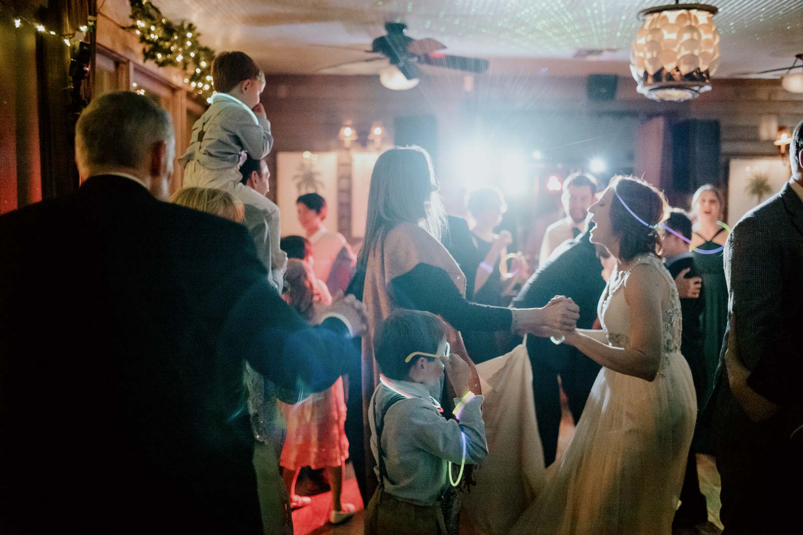 Guests dance on reception floor at Ouisie's Table in Houston