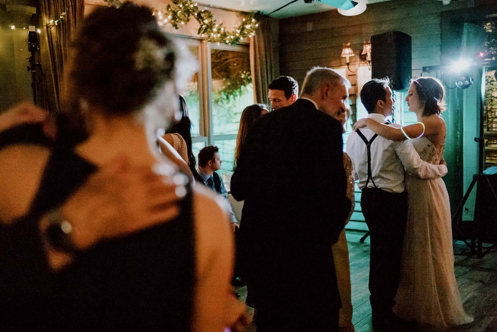 Bride and groom at Martin and Katie tied the knot at the Cathedral of Our Lady of Walsingham, and their reception was at Ouisie's Table in Houston. dance together with parents middle and another couple dancing closest to camers