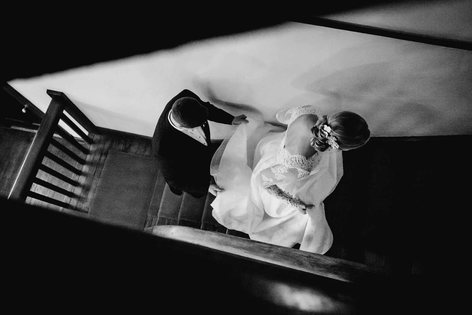 San Antonio photographer Philip Thomas captures Couple climb staircase inside Hotel Havana in San Antonio on their wedding day