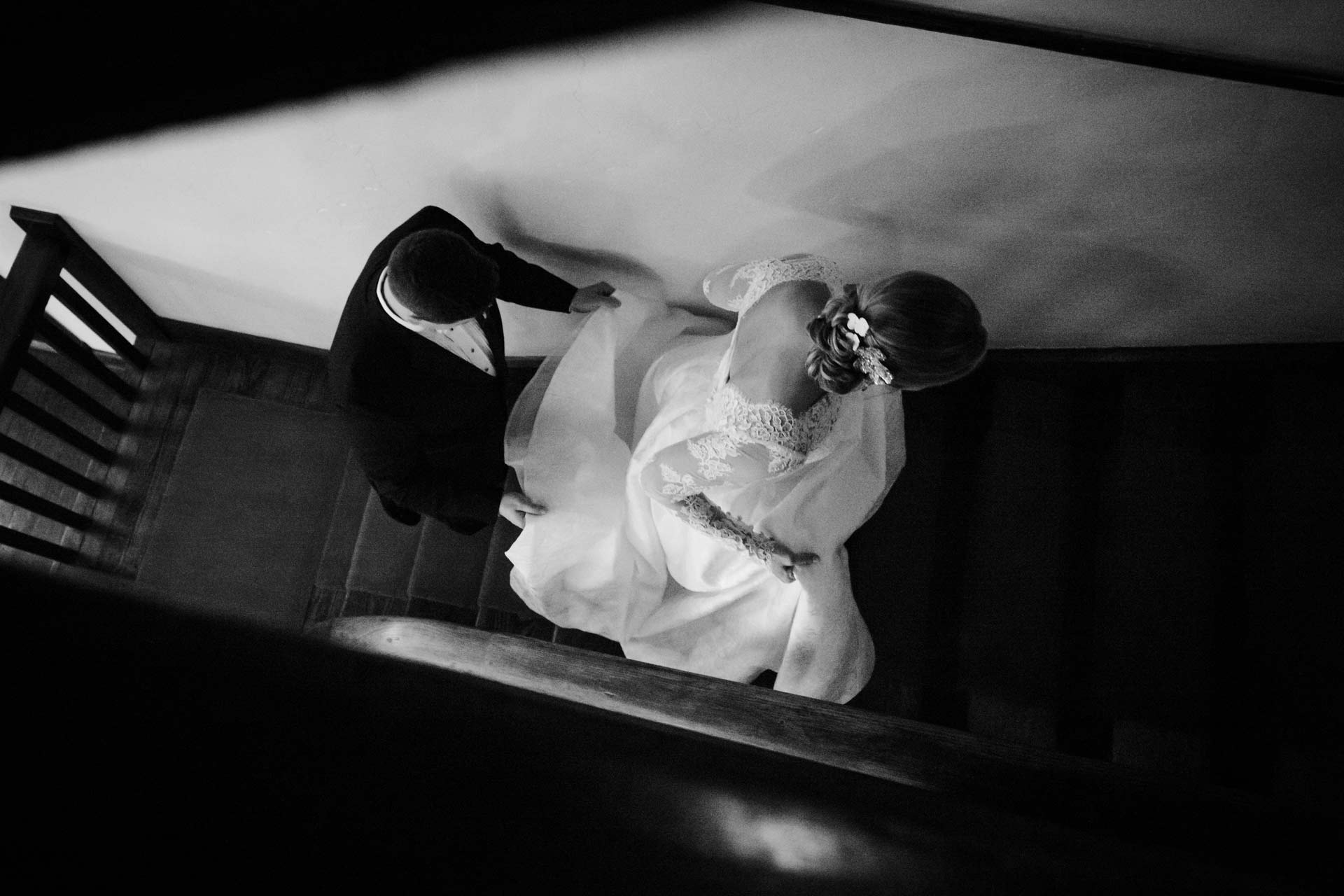 San Antonio photographer Philip Thomas captures Couple climb staircase inside Hotel Havana in San Antonio on their wedding day