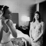 A proud mother of the bride observes her daughter getting ready on her wedding day St Anthony Hotel