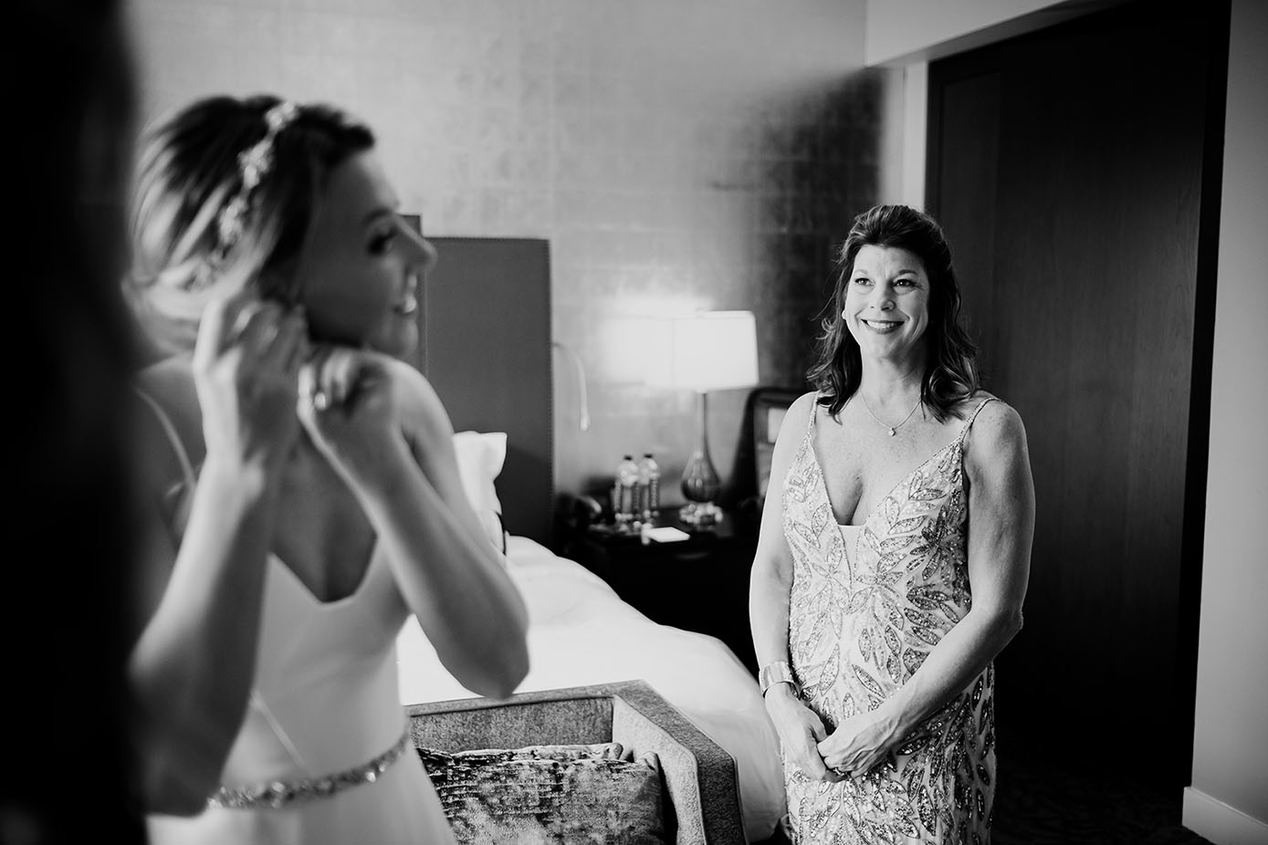 A proud mother of the bride observes her daughter getting ready on her wedding day St Anthony Hotel
