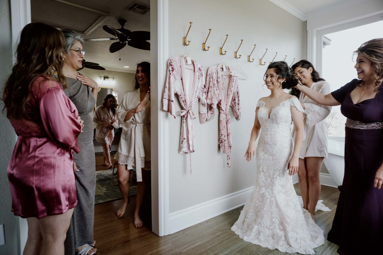 Her mother-in-law gasps in delight seeing her daughter-in-law in the dress the first time