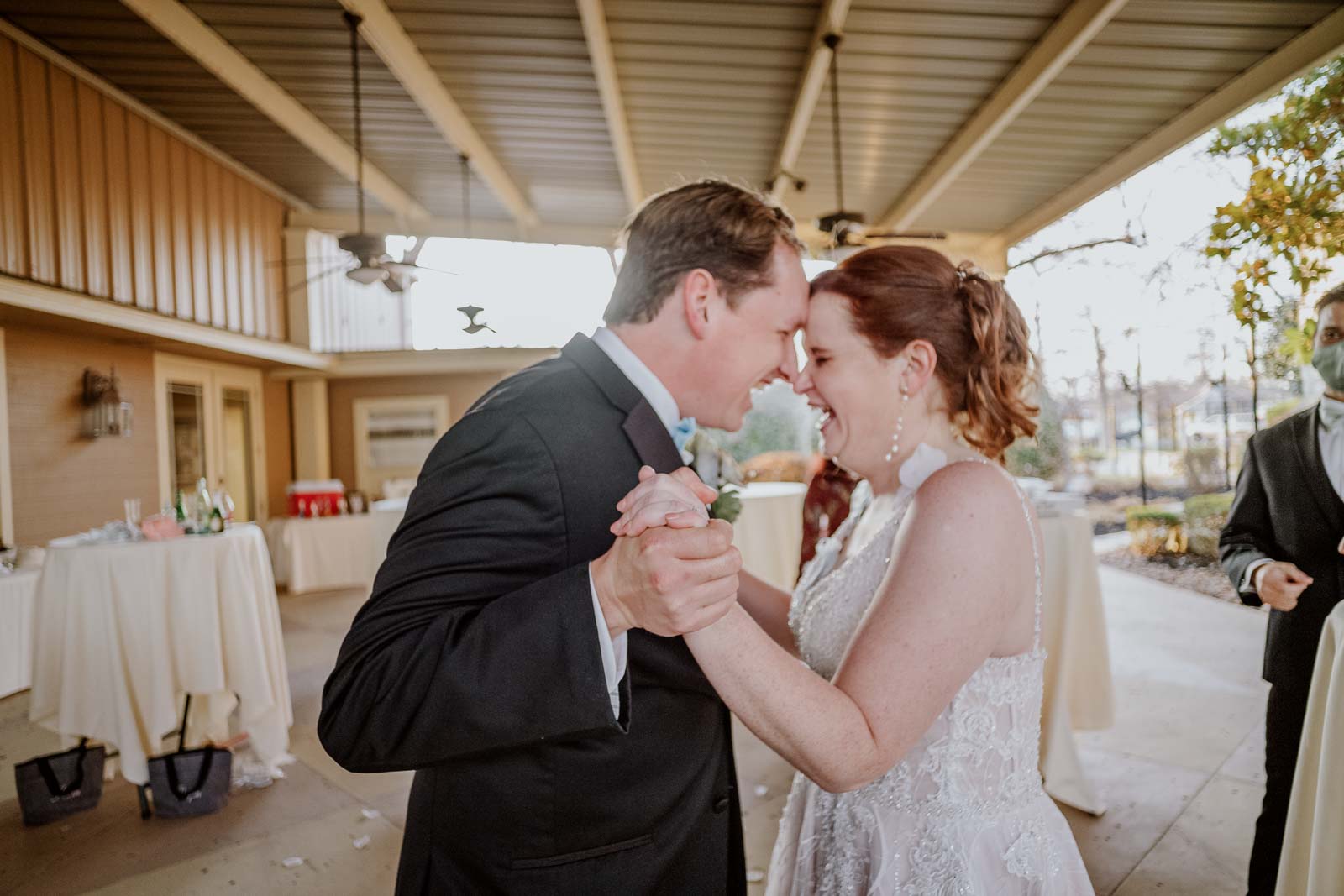 A couple lean in as they laugh hysterically in a beautiful moment captured on a Leica M rangefinder Spinelli's Wedding Venue Winter Wedding Kristen_Christopher-Leica photographer-Philip Thomas Photography