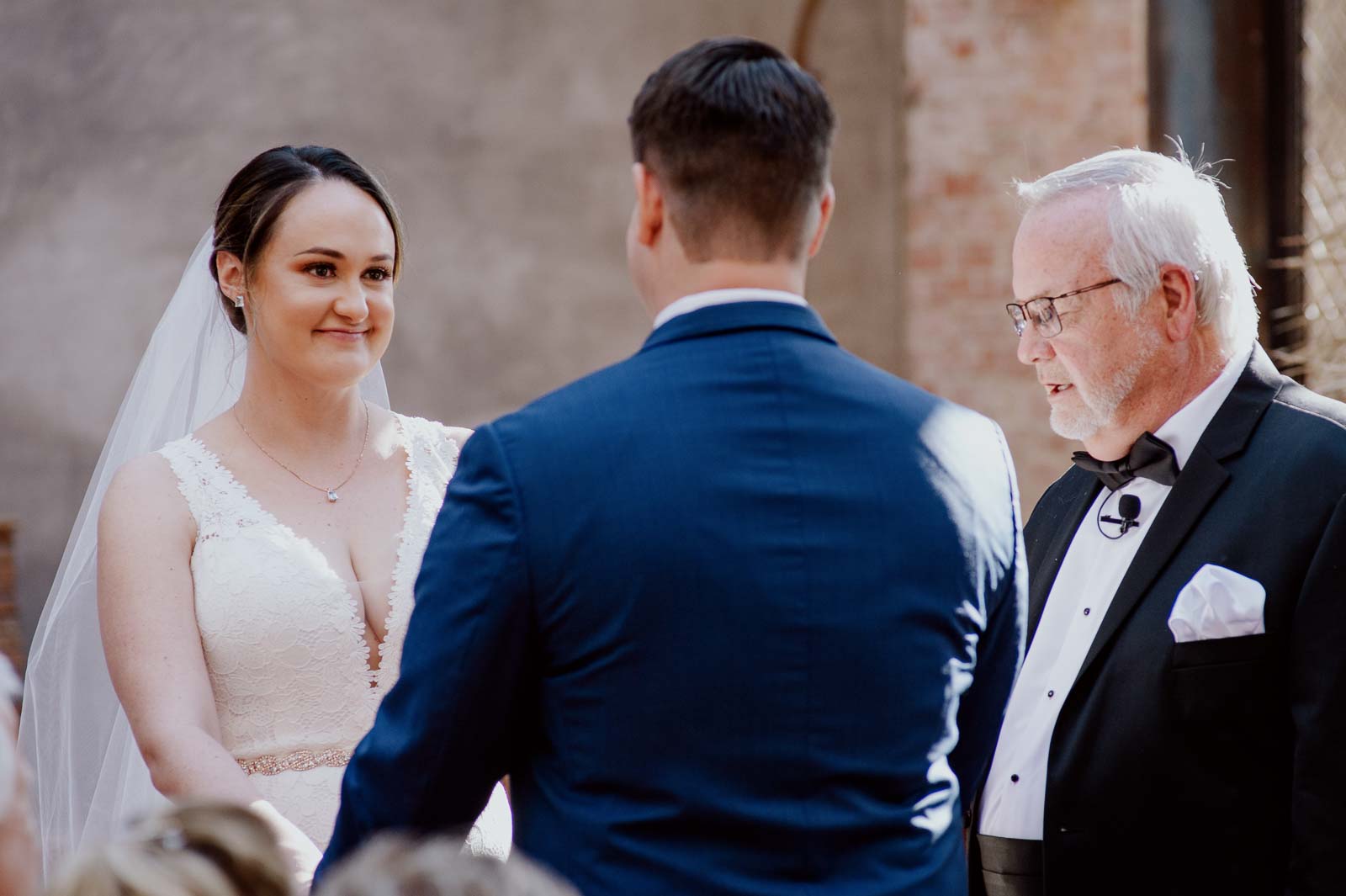 During the vows at Hotel Emma the bride takes a moment to look at her husband to be