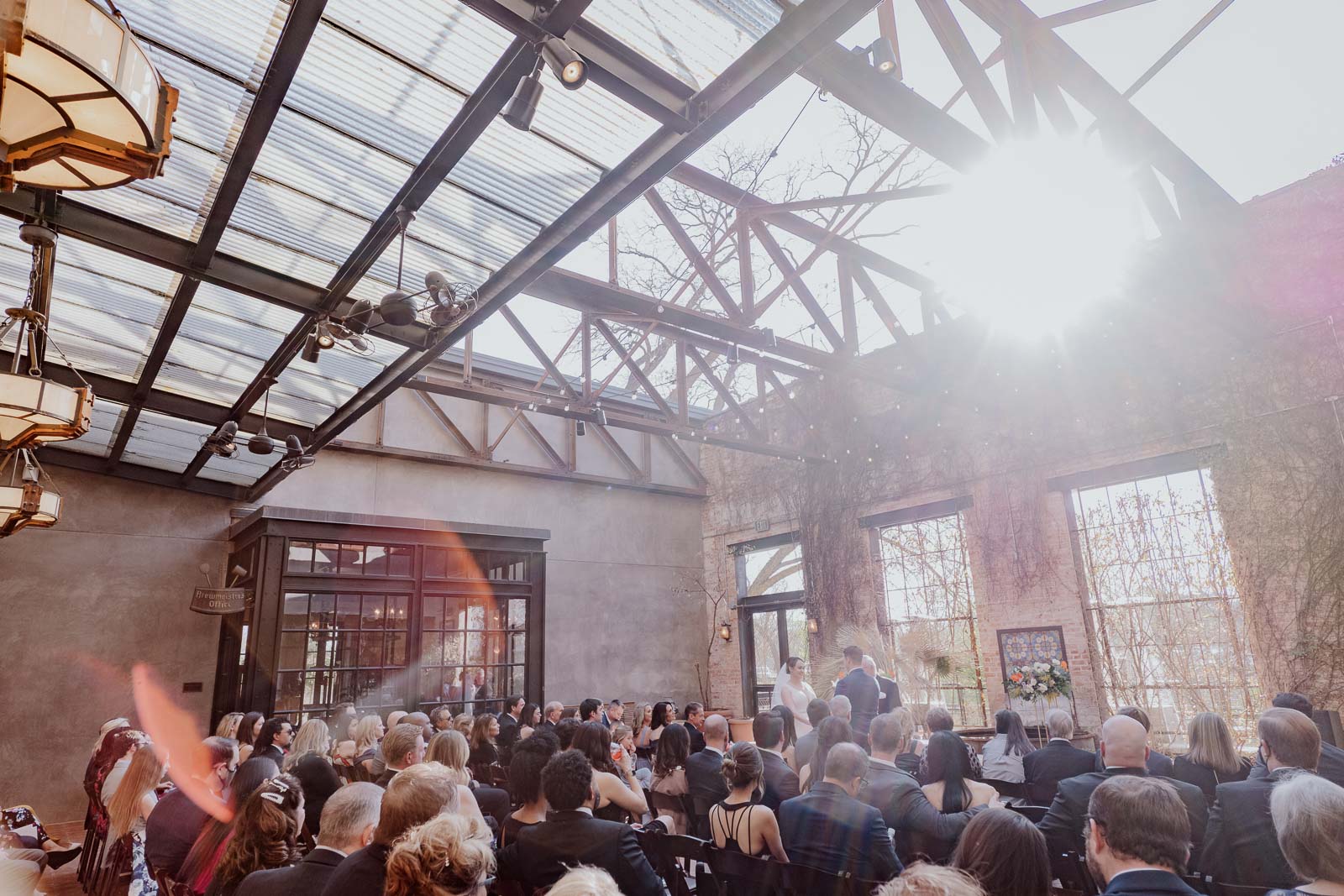 Photograph at Hotel Emma on the first day of spring with lens flare in the photograph a wide angle shot of the ceremony