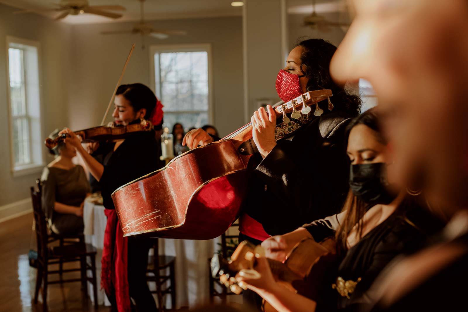 Mariachis play at sunset in the wedding reception