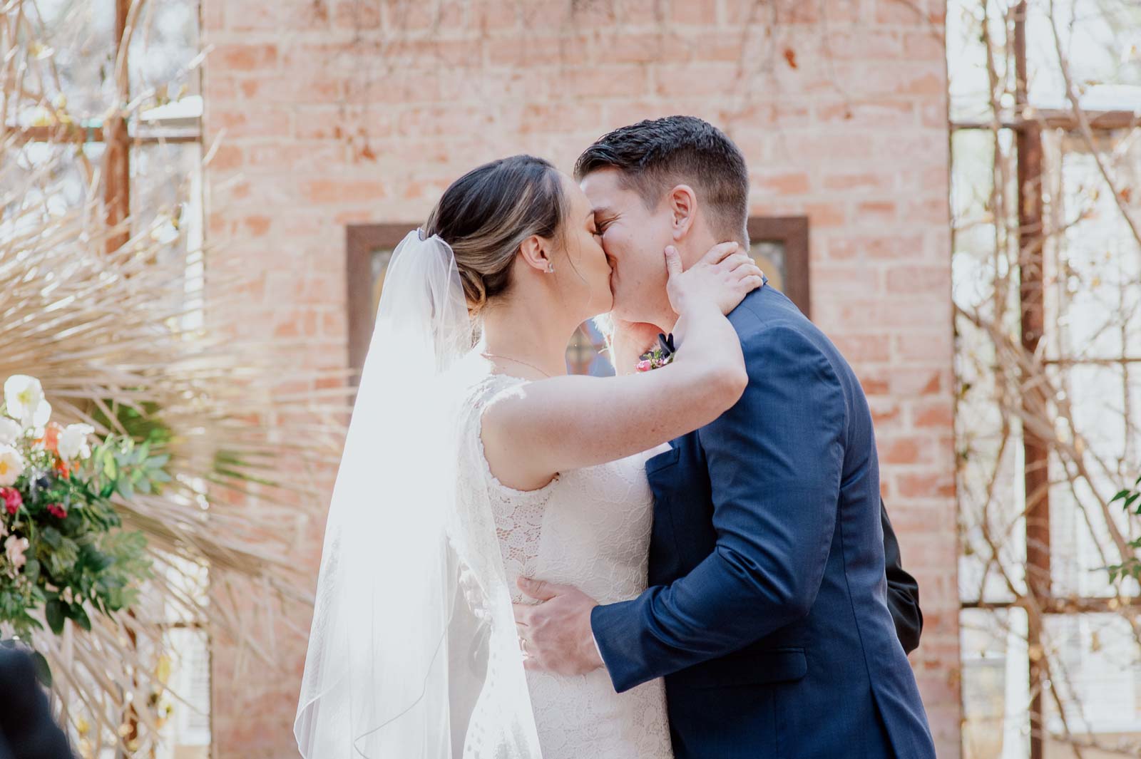 The couple seal the ceremony with a kiss and now married at Hotel Emma