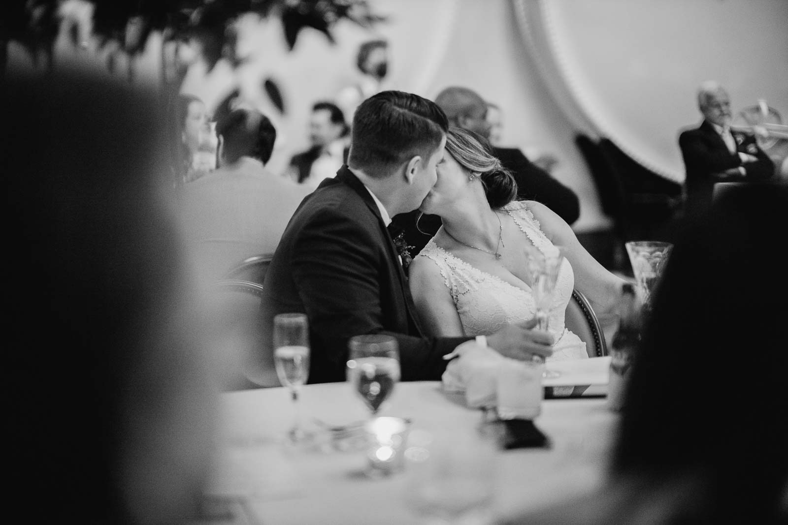 The couple steal a kiss during the first toast
