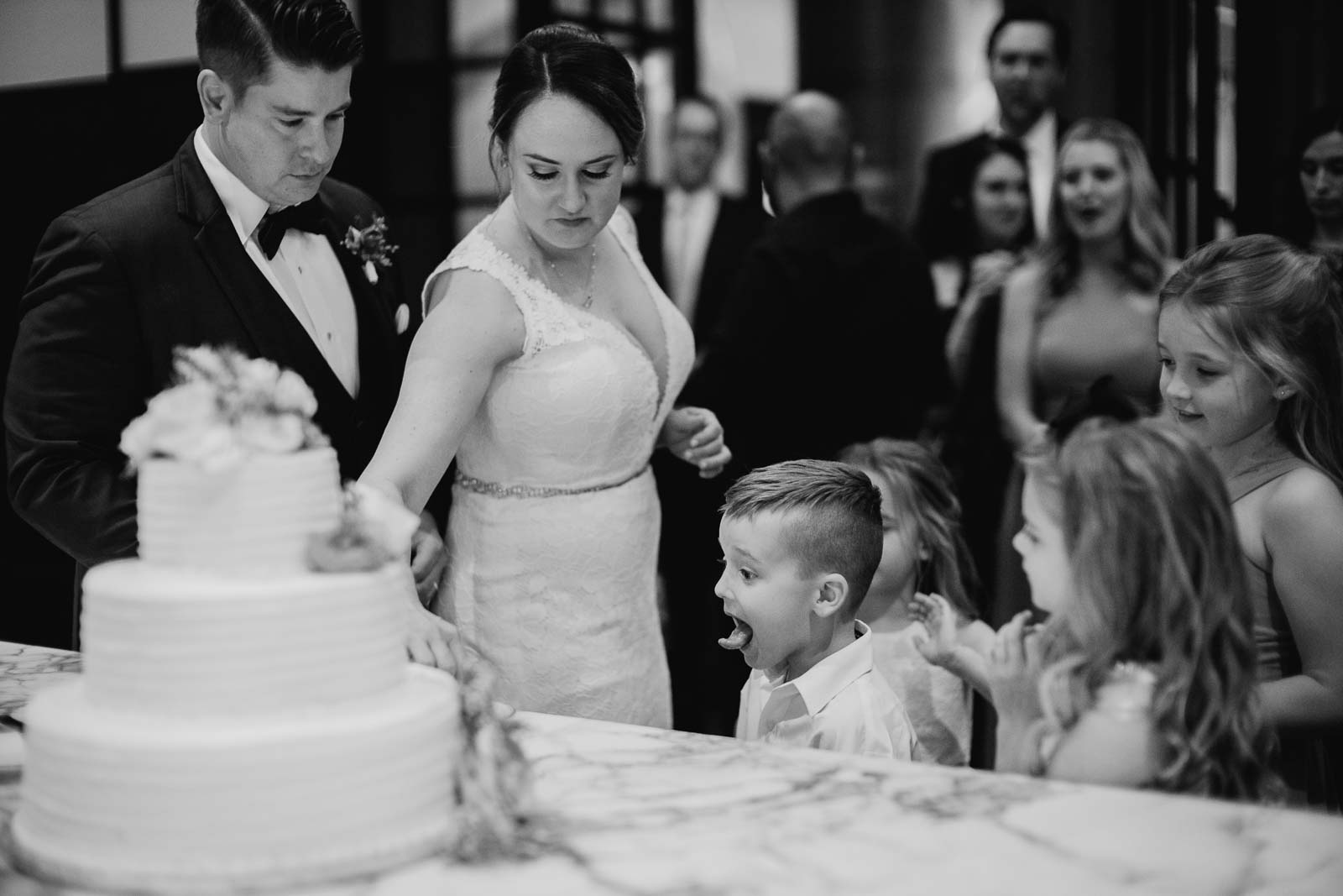 During the cake cutting at Hotel Emma the ringbearer steals the show as he pokes out his tongue to eat some cake in a very funny moment