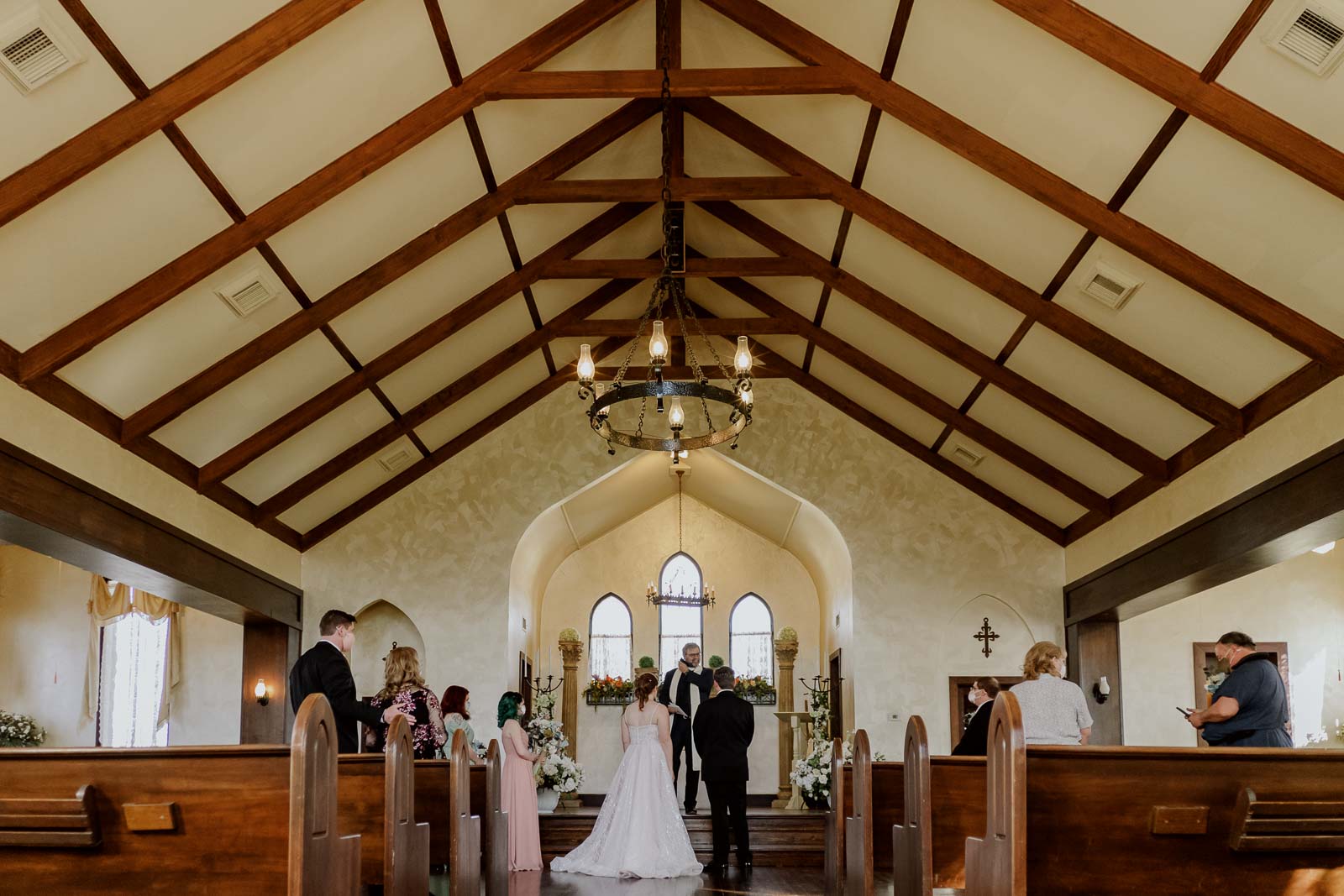 at Spinelli‘s the historic church has converted to a wedding venue during Covid pandemic with Bride and groom in center of image