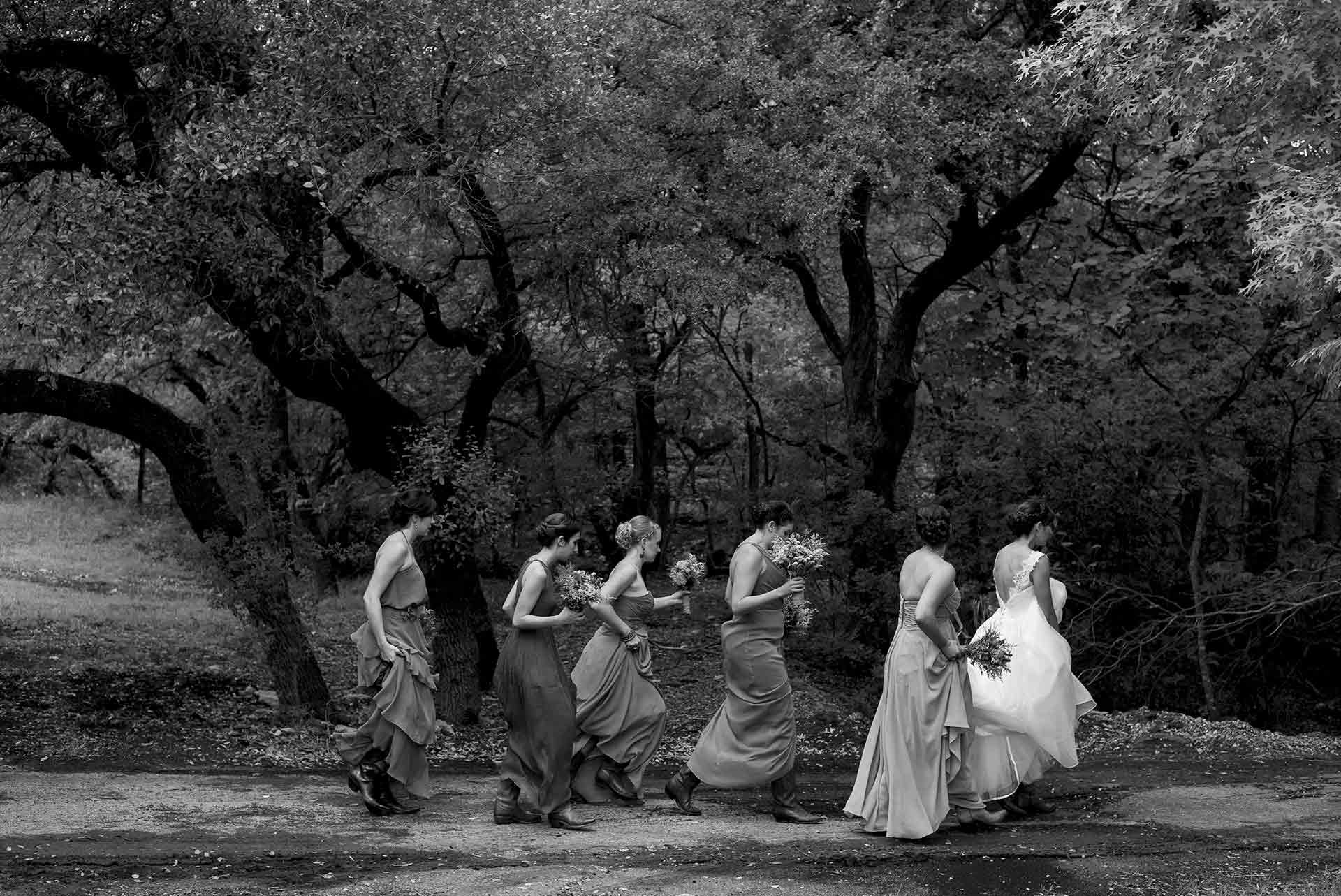 San Antonio wedding photographer Philip Thomas captures Bridesmaids and bride walking to ceremony in a Hill Country Wedding