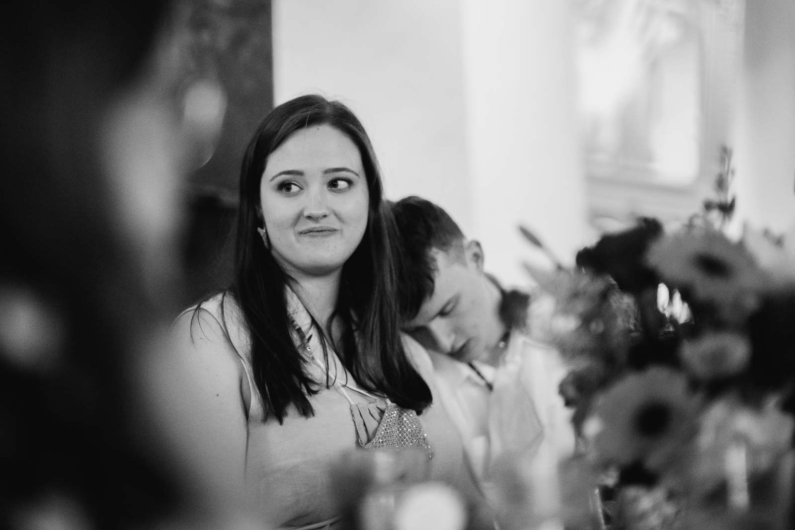 During the rehearsal dinner sit down dinner break is away as the groom closes his eyes and rest his head on her shoulder