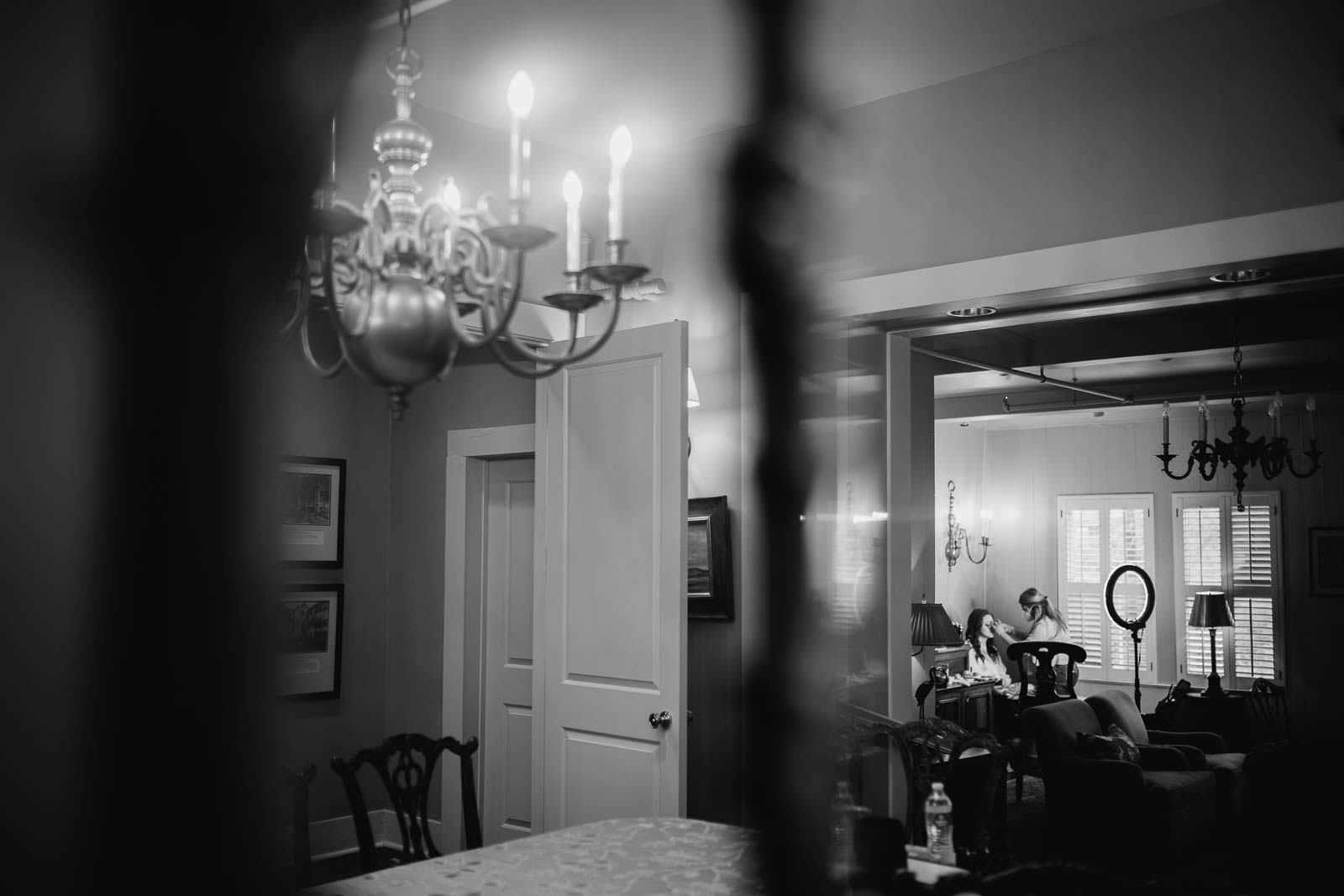 A photograph for a mirror of the chandelier has a bride gets ready at the Argyle