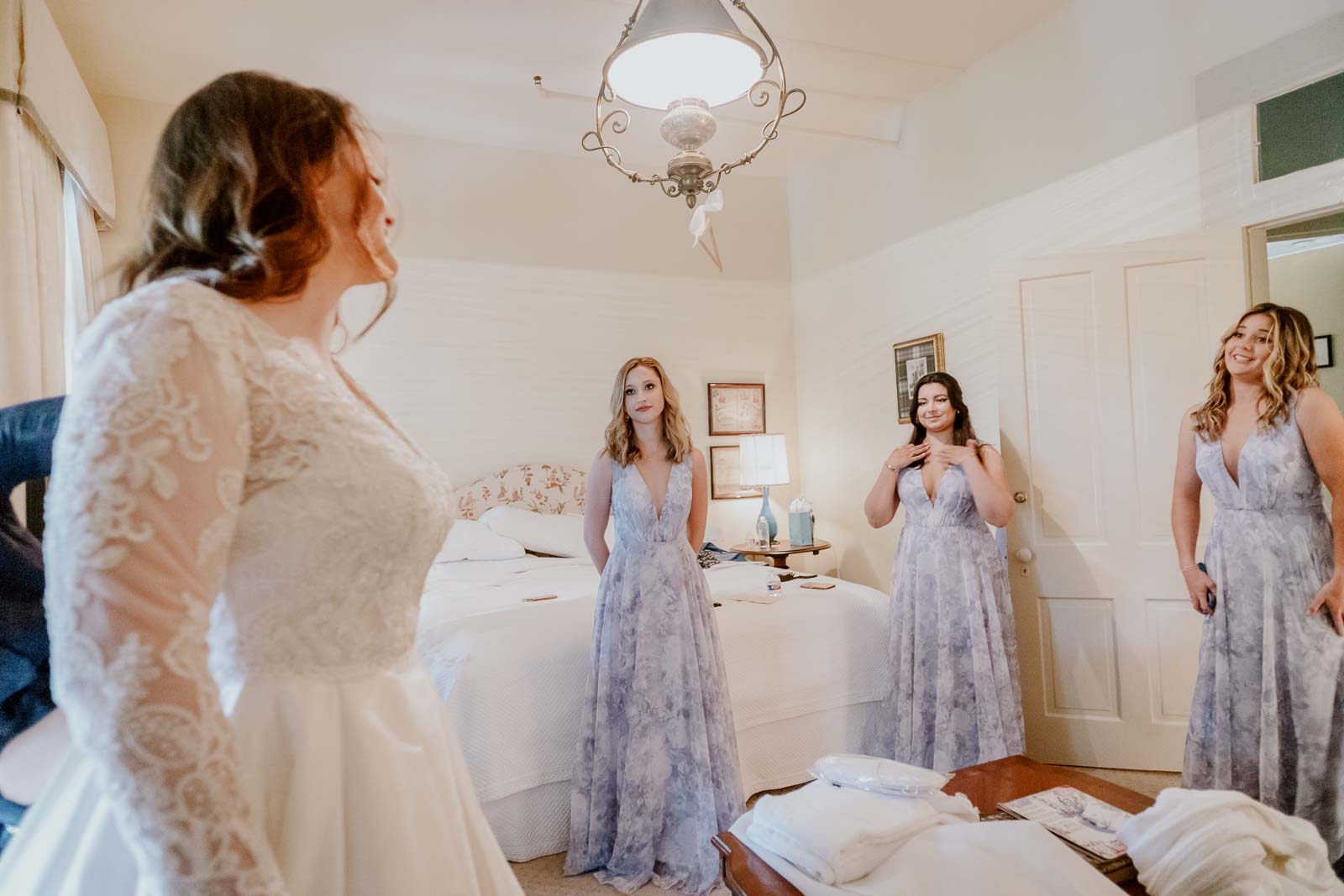 The bridesmaids reaction to seeing the bride and her dress the first time