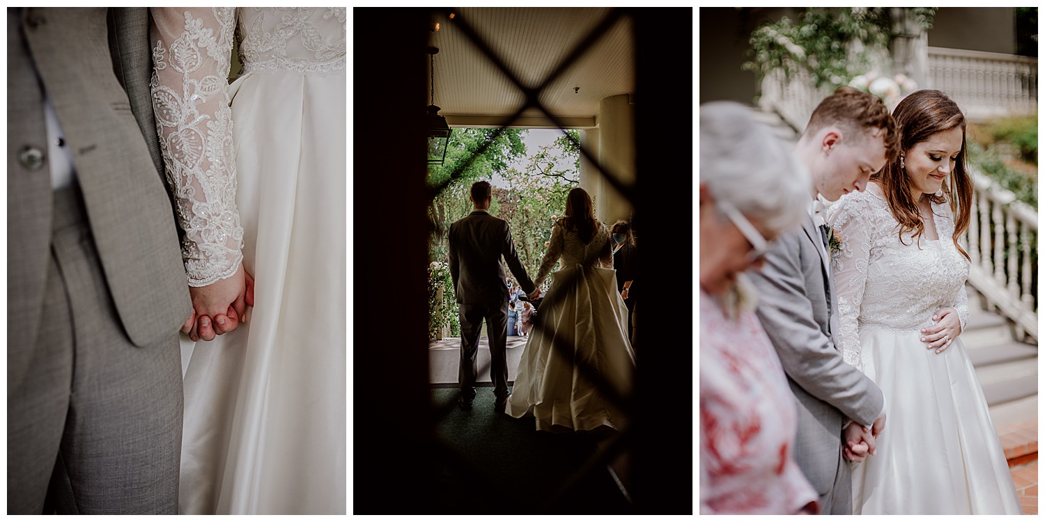 The bride and groom get ready to exit out onto the reception with the crowd waiting photographed in black-and-white with staircase in foreground