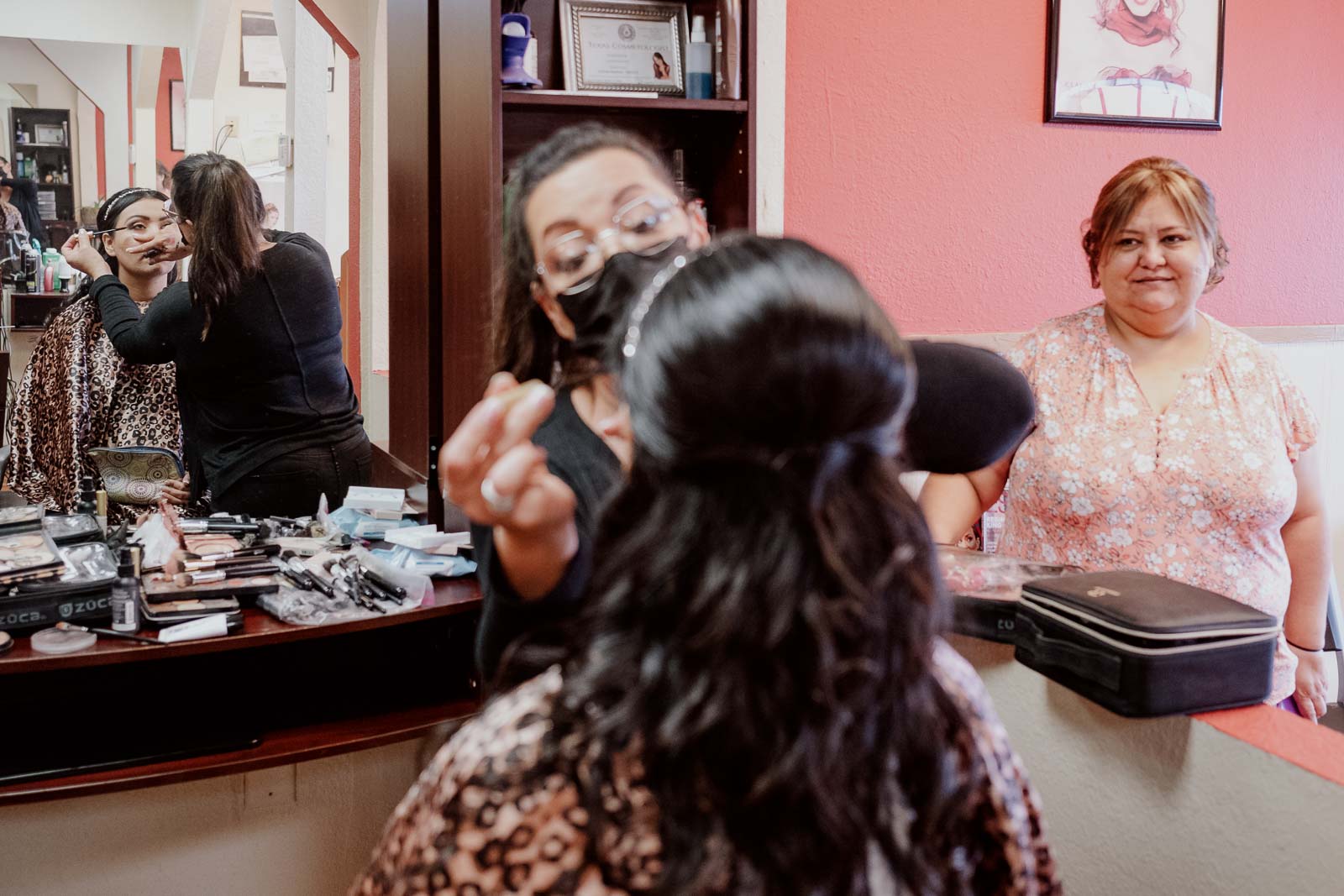 Make up applied to bride as mother looks on in mirror Sacred Heart Chapel-Leica photographer-Philip Thomas Photography