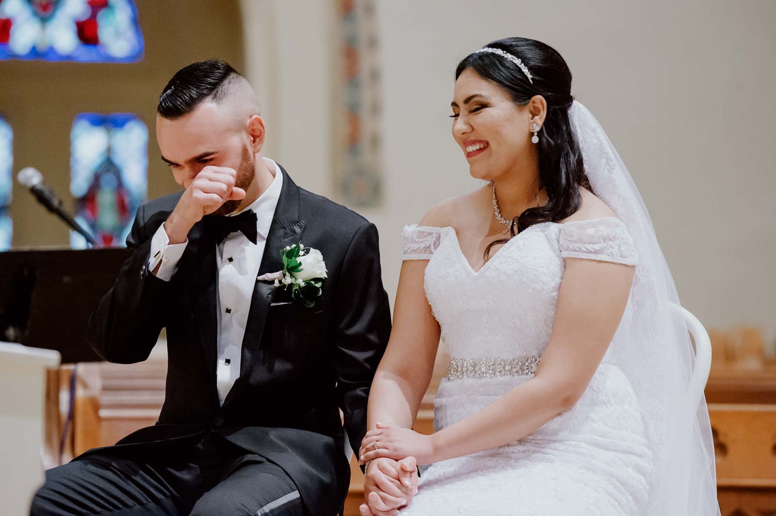 The groom wipes away tears of joy at a wedding ceremony   Sacred Heart Chapel-Leica photographer-Philip Thomas Photography