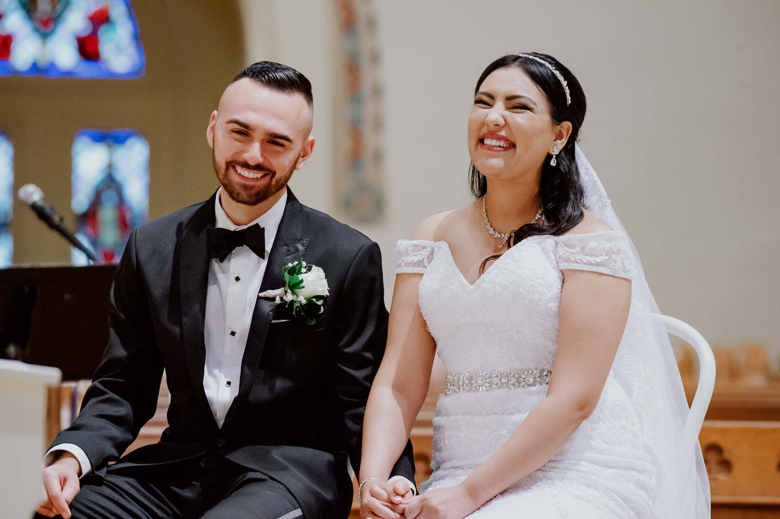 Moments later laughter and joy breaks out from the bride and groom at Sacred Heart Chapel-Leica photographer-Philip Thomas Photography